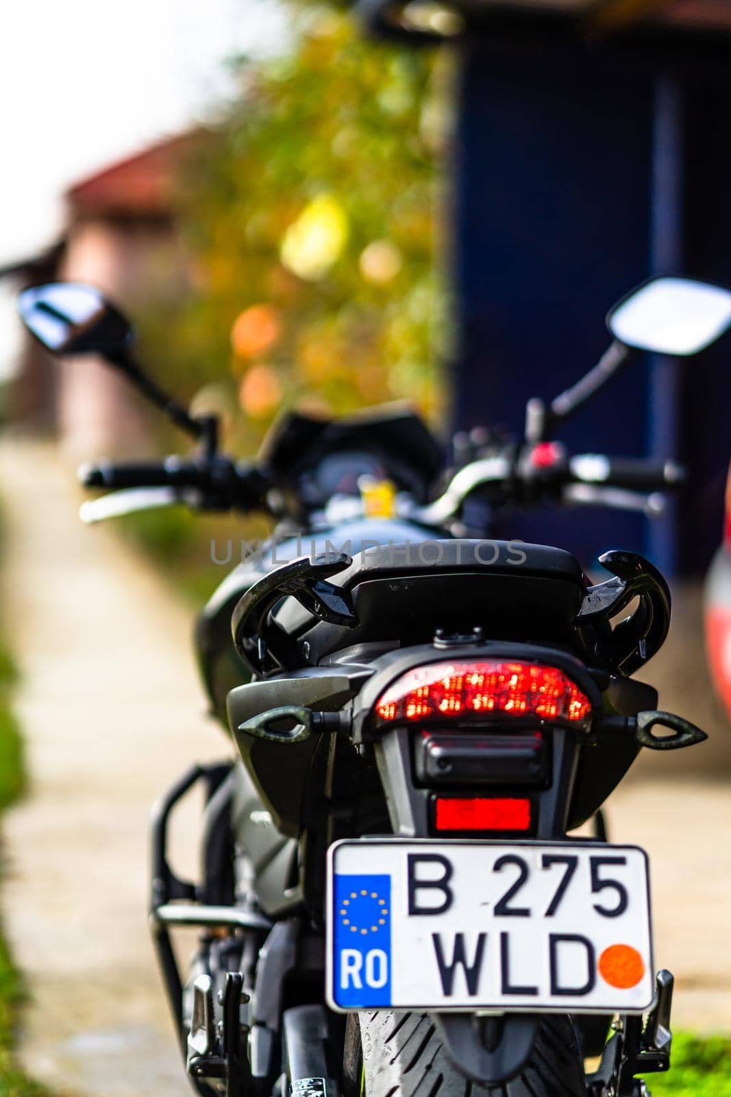 Detail of black motorcycle. Honda Hornet motorcycle detail photo in Bucharest, Romania, 2021 by vladispas