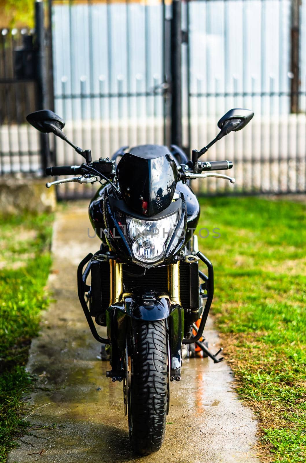 Detail of black motorcycle. Honda Hornet motorcycle detail photo in Bucharest, Romania, 2021 by vladispas