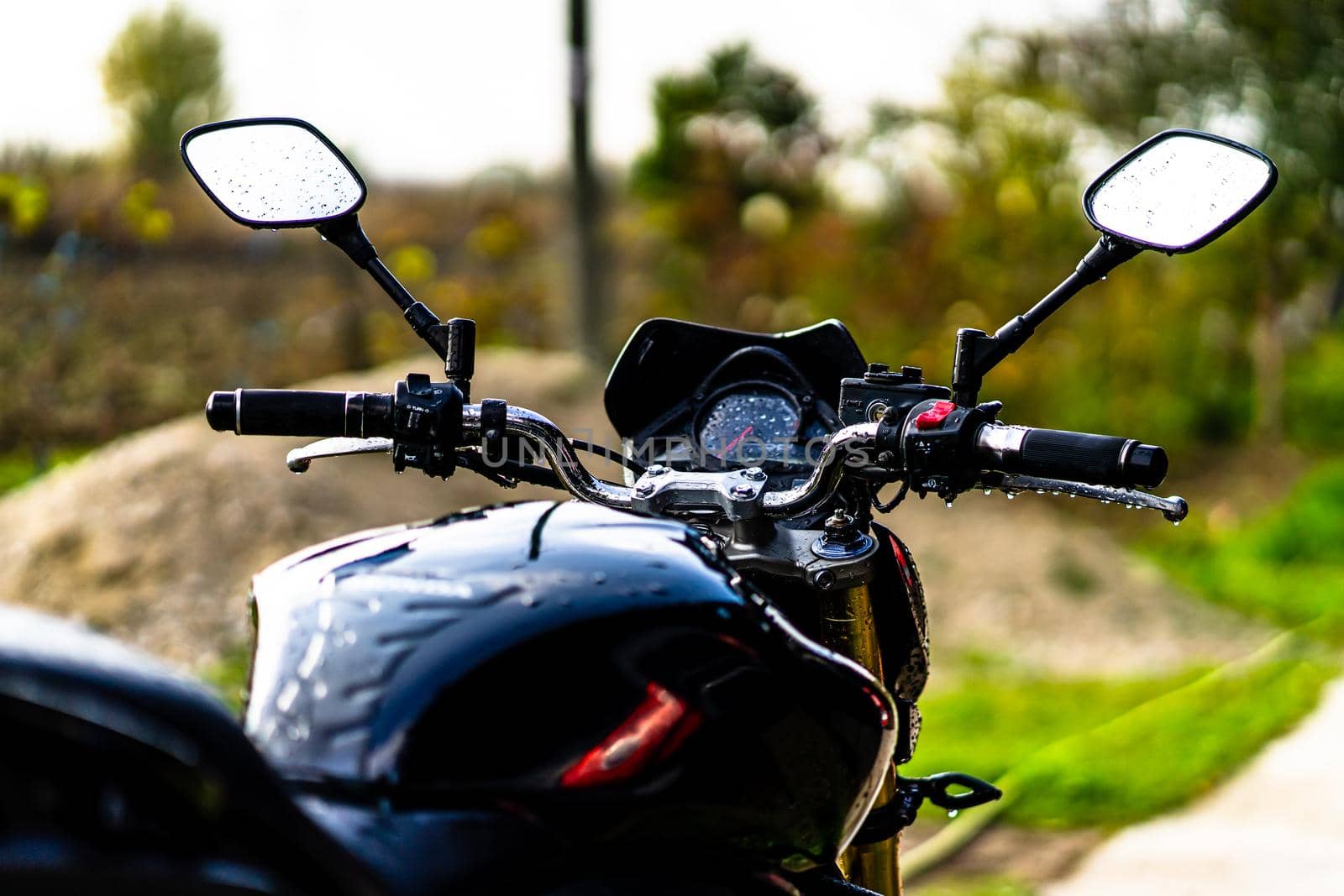 Detail of black motorcycle. Honda Hornet motorcycle detail photo in Bucharest, Romania, 2021 by vladispas