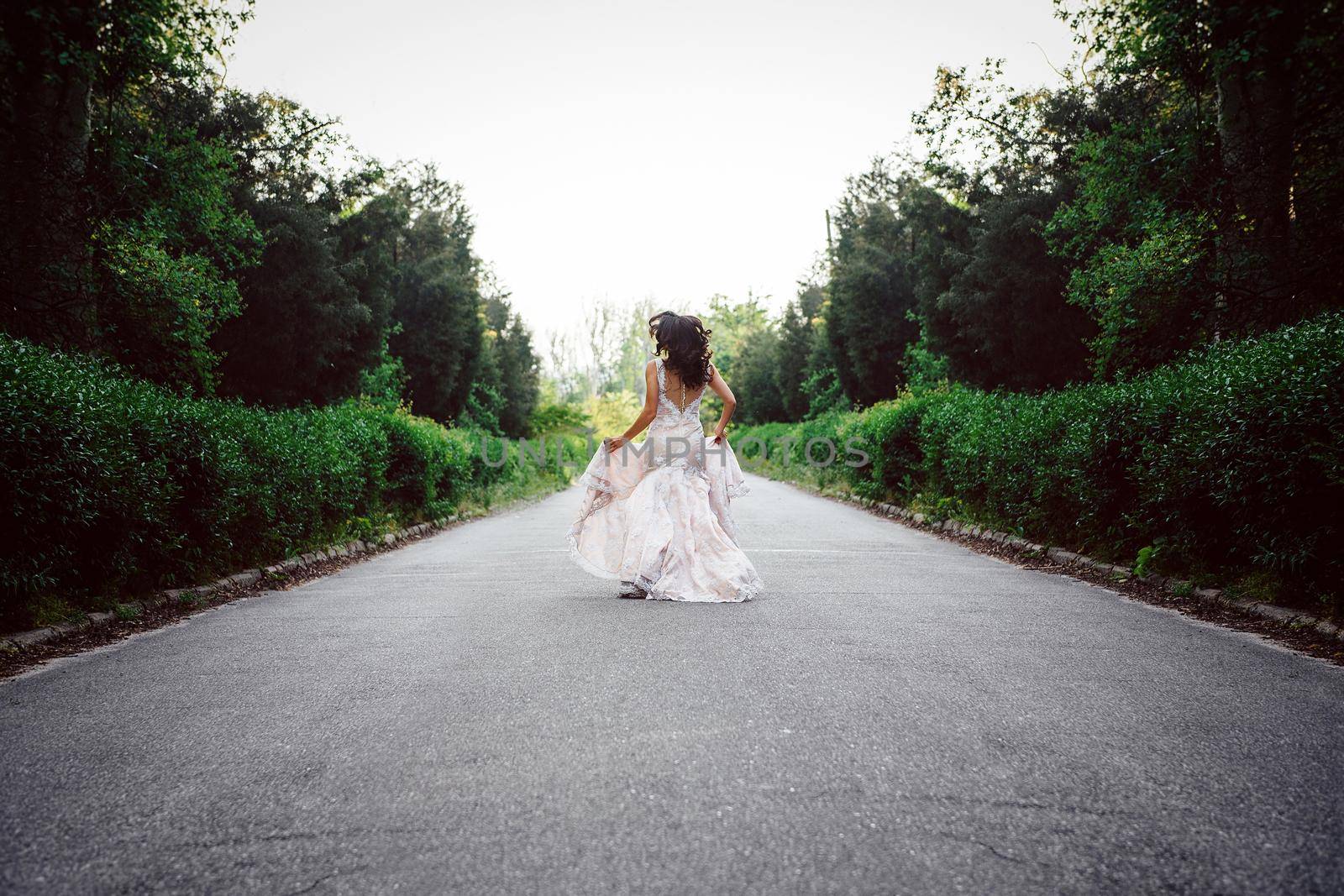 dress up the bride in a wedding dress with corset and lacing