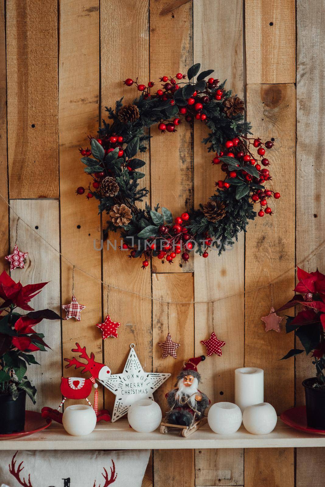 new year festive decorations in warm colors, christmas tree and christmas wreath