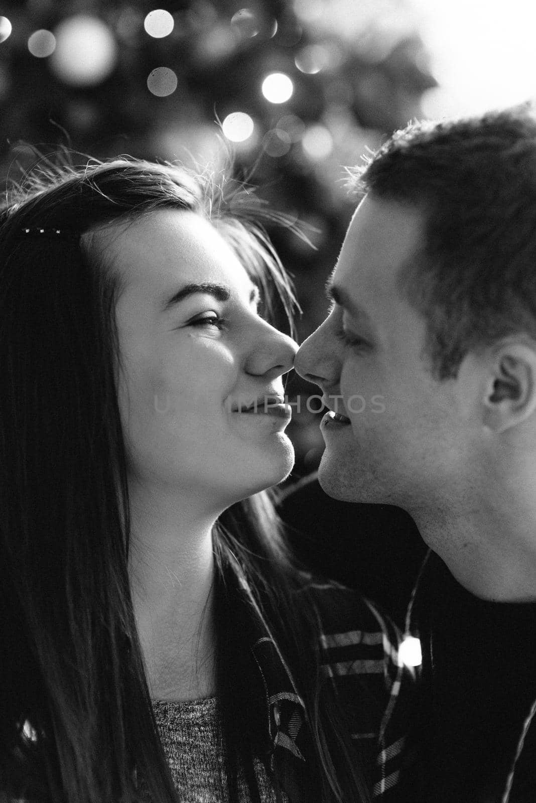 a guy and a girl celebrate the new year together
in a warm atmosphere and give each other gifts