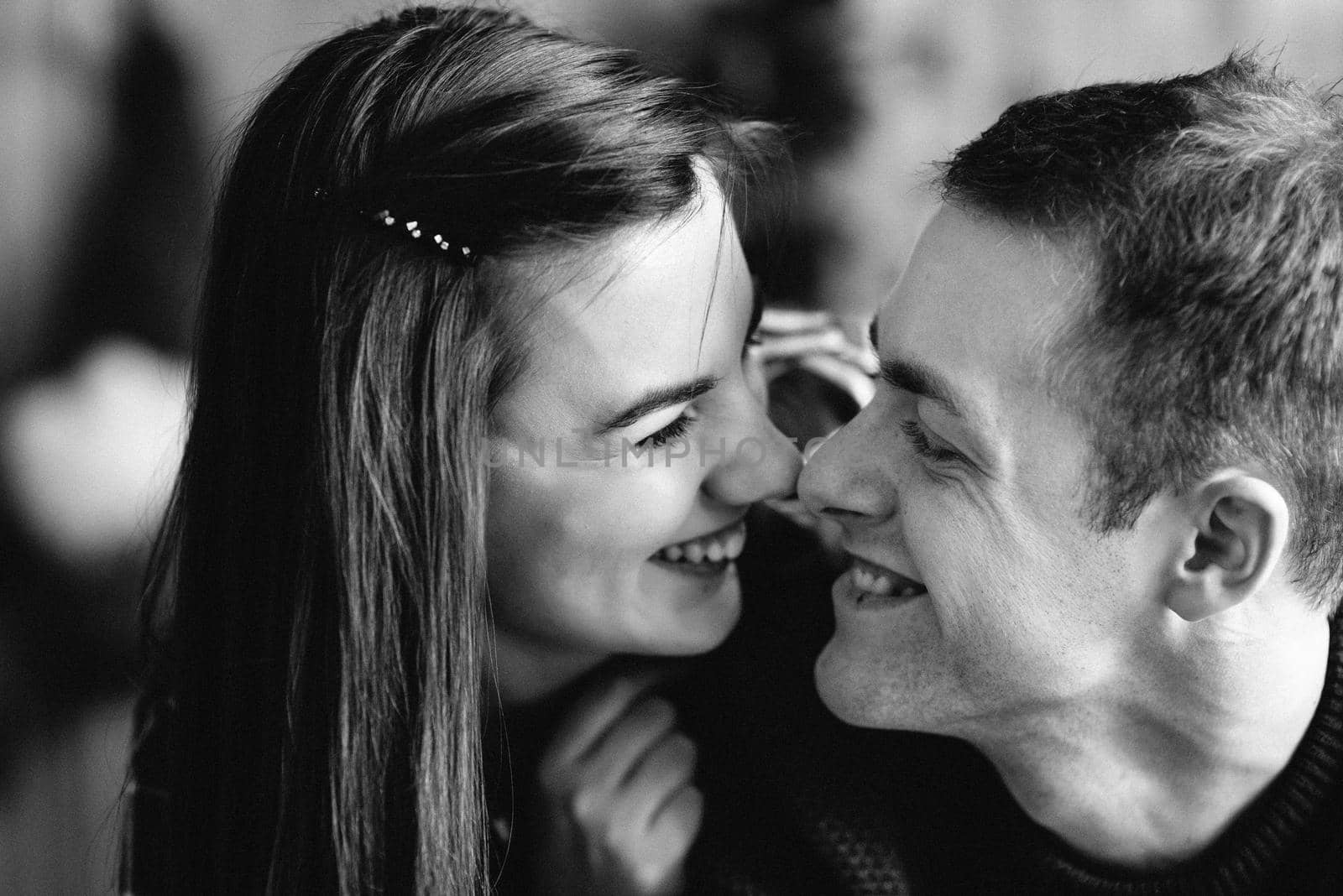 a guy and a girl celebrate the new year together
in a warm atmosphere and give each other gifts