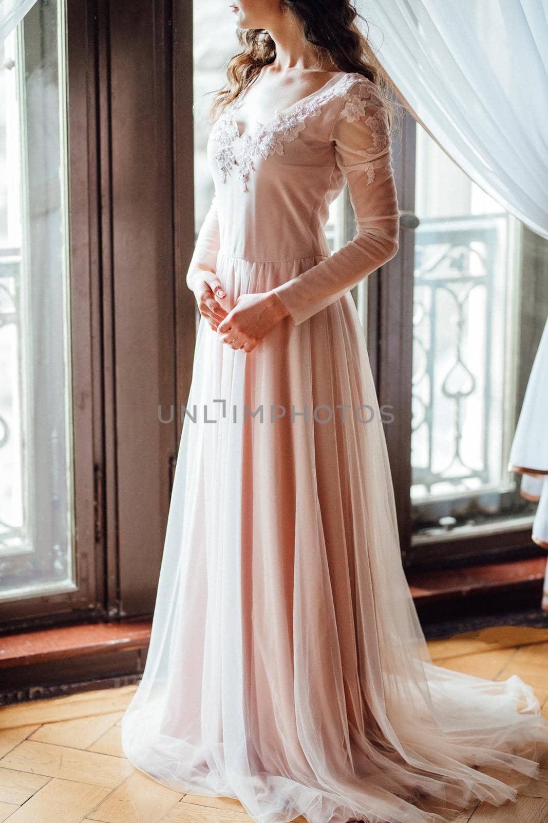 A girl in a light pink dress against the background of a medieva castle by Andreua