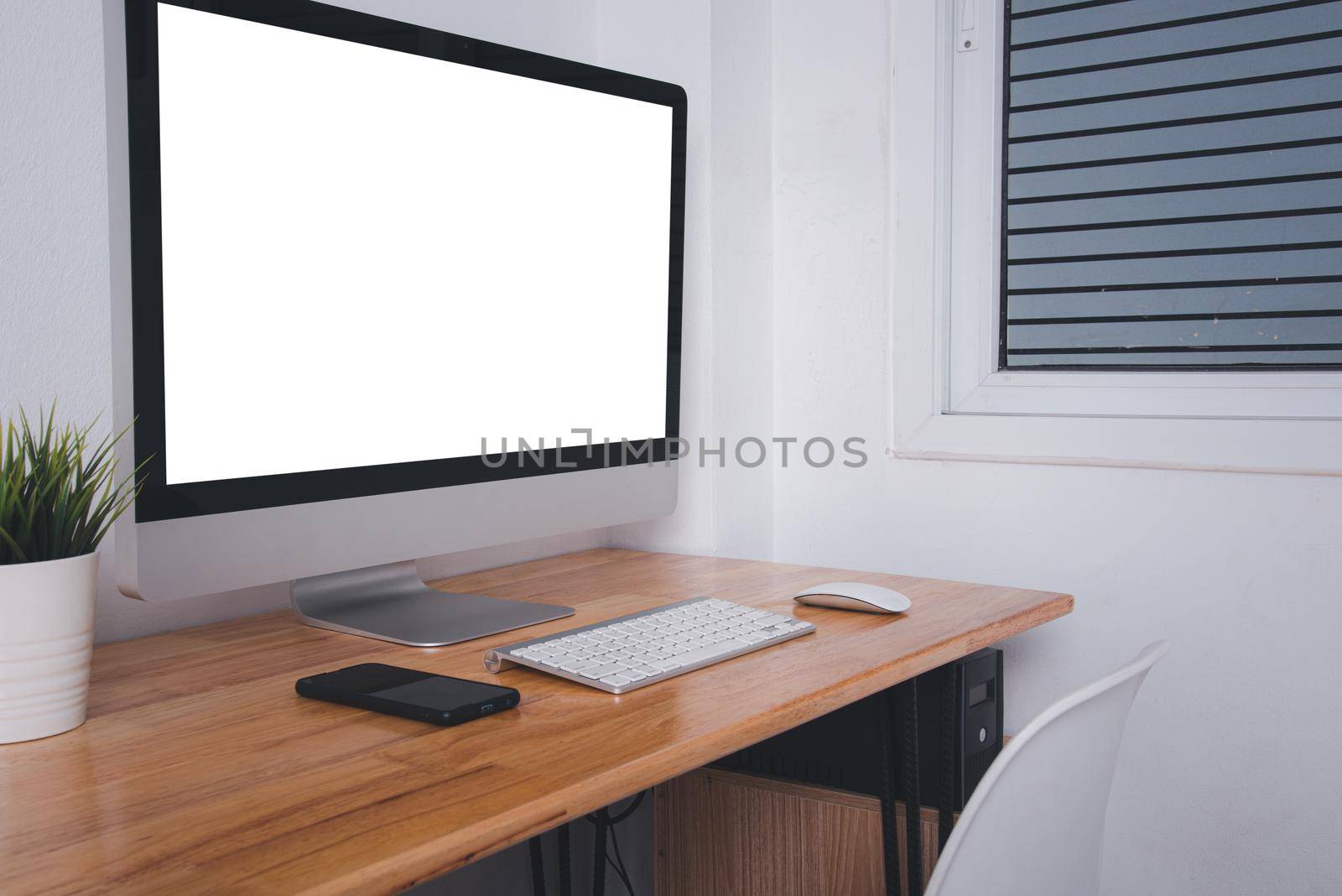 Computer monitor with white blank screen on the business desk by Sorapop