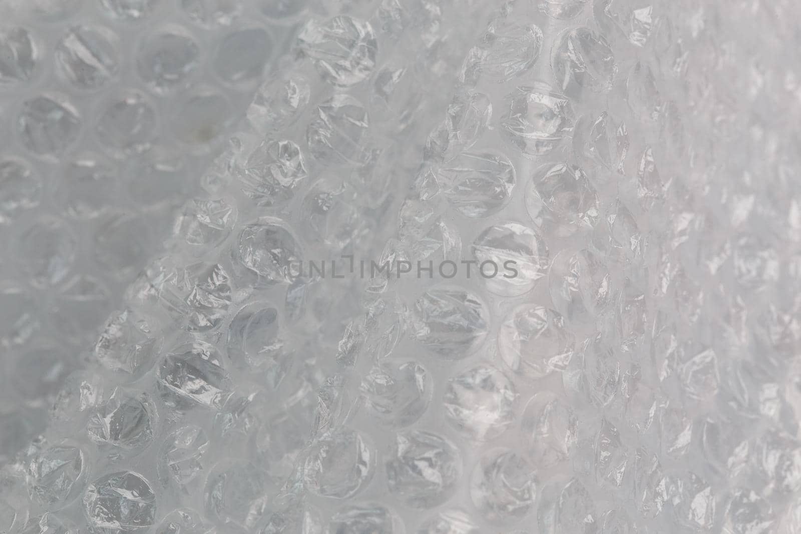 crumpled air bubble wrap - real life close-up background.