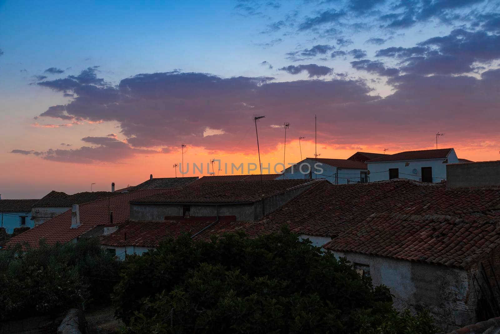 Sunset in a town in southern Andalusia, with beautiful shades of orange and blue