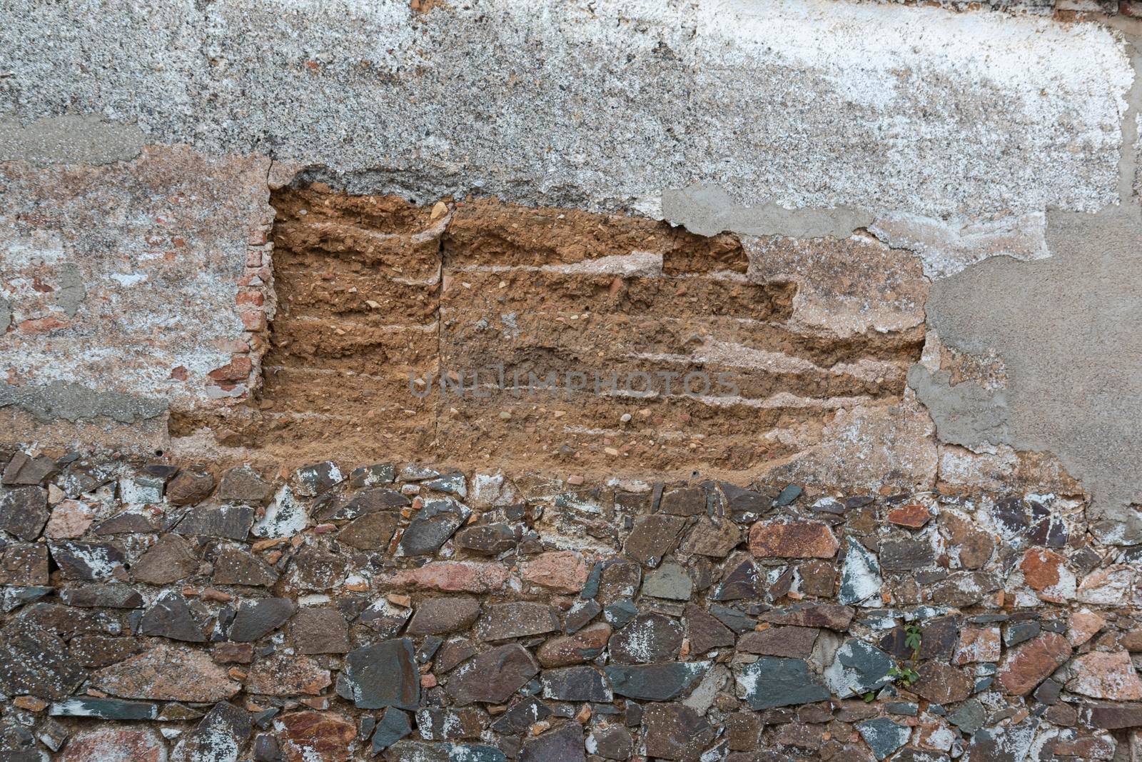 old stone wall collapsing in southern spain