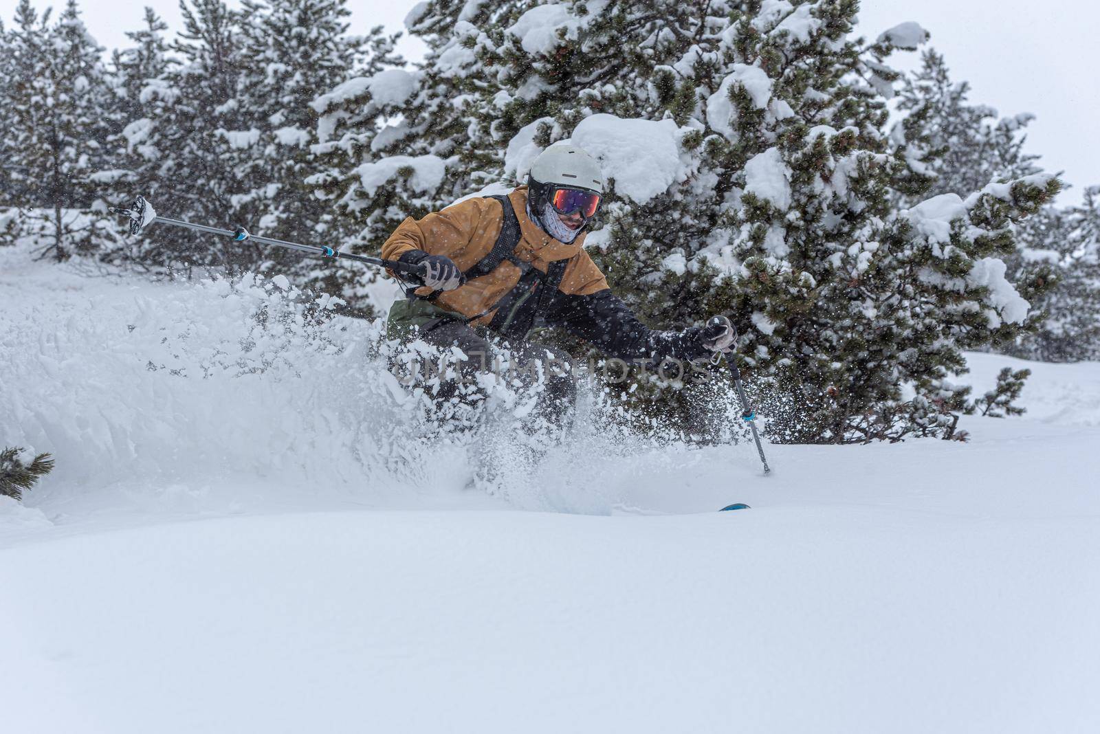 Young man skiing in the Pyrenees at the Grandvalira ski resort in Andorra in Covid19 time.