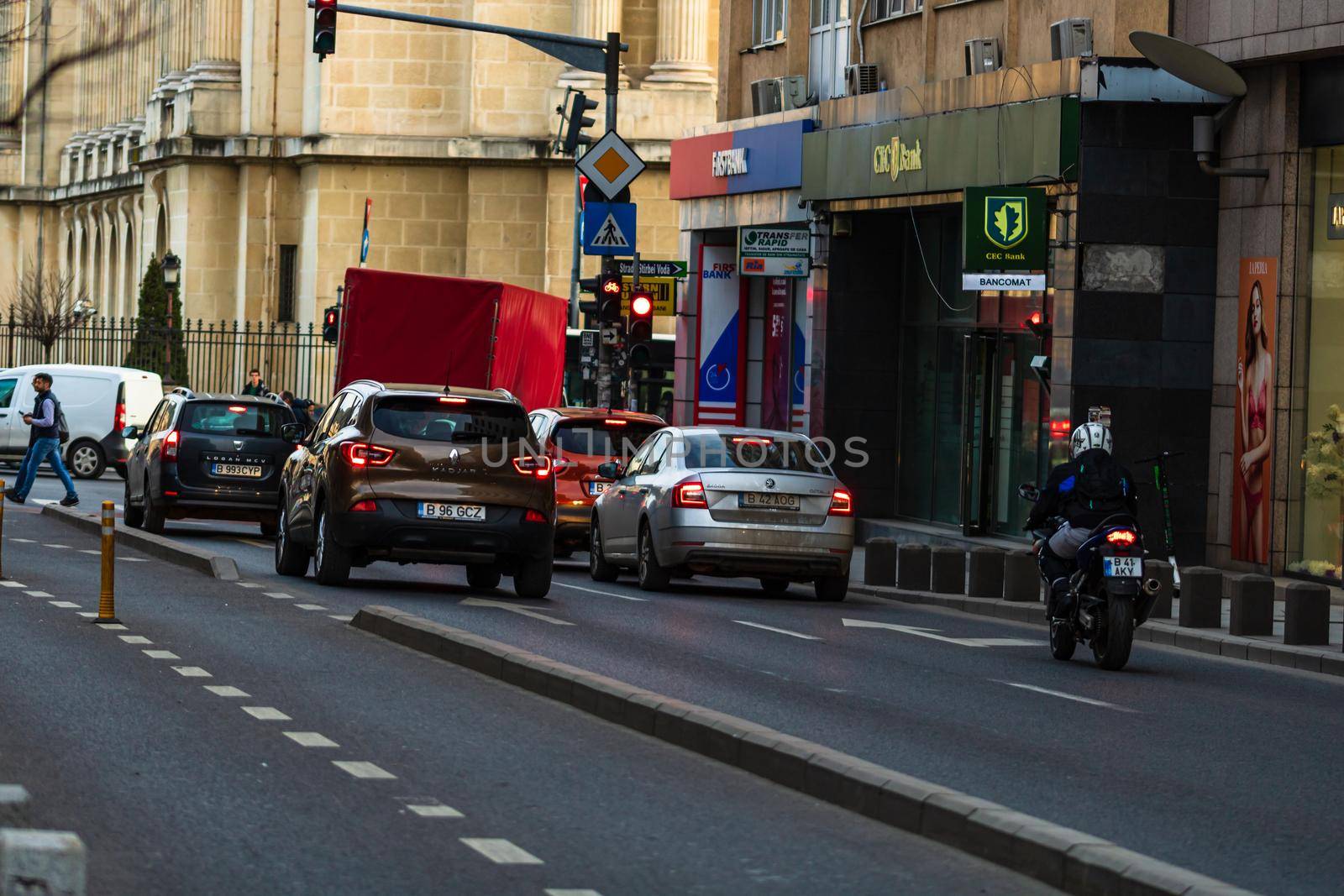 Car traffic at rush hour in downtown area of the city. Car pollution, traffic jam in the morning and evening in the capital city of Bucharest, Romania, 2020 by vladispas