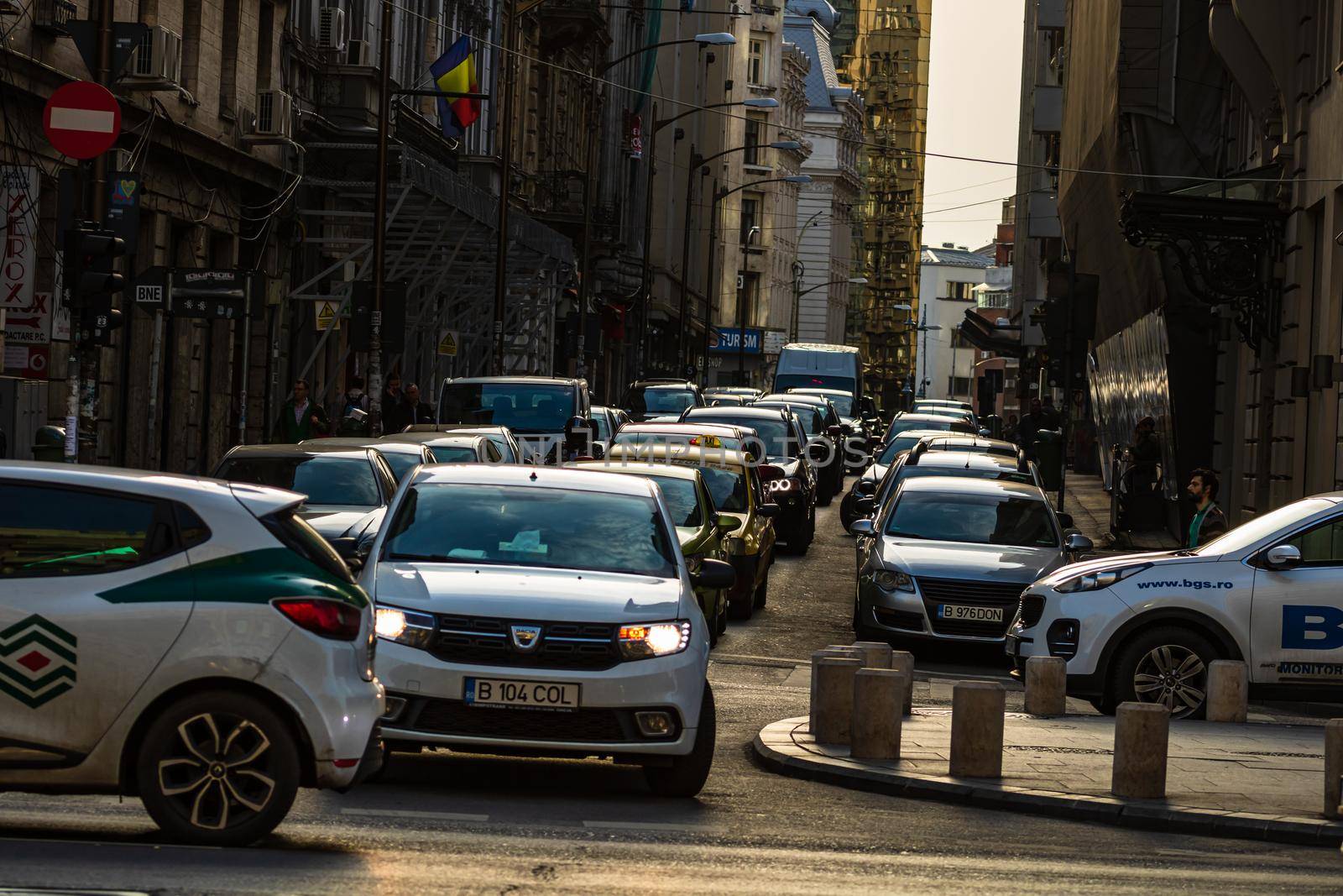 Car traffic at rush hour in downtown area of the city. Car pollution, traffic jam in the morning and evening in the capital city of Bucharest, Romania, 2020 by vladispas