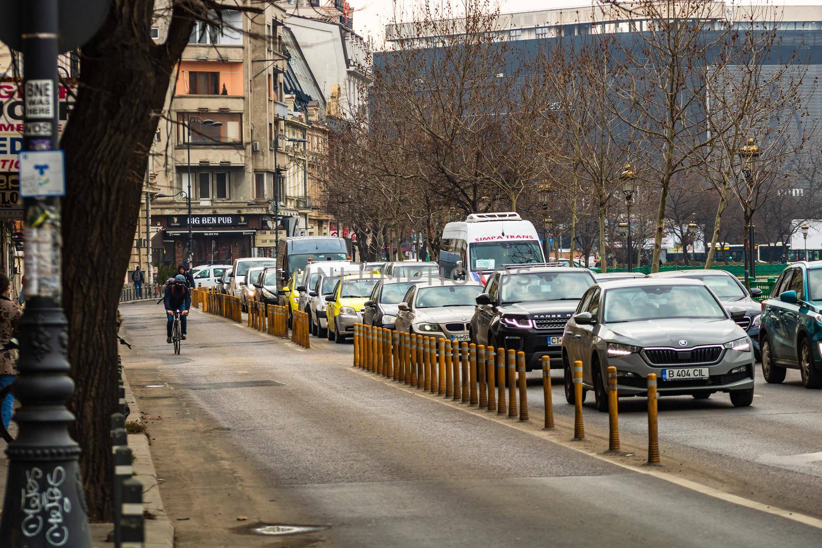 Car traffic at rush hour in downtown area of the city. Car pollution, traffic jam in the morning and evening in the capital city of Bucharest, Romania, 2020