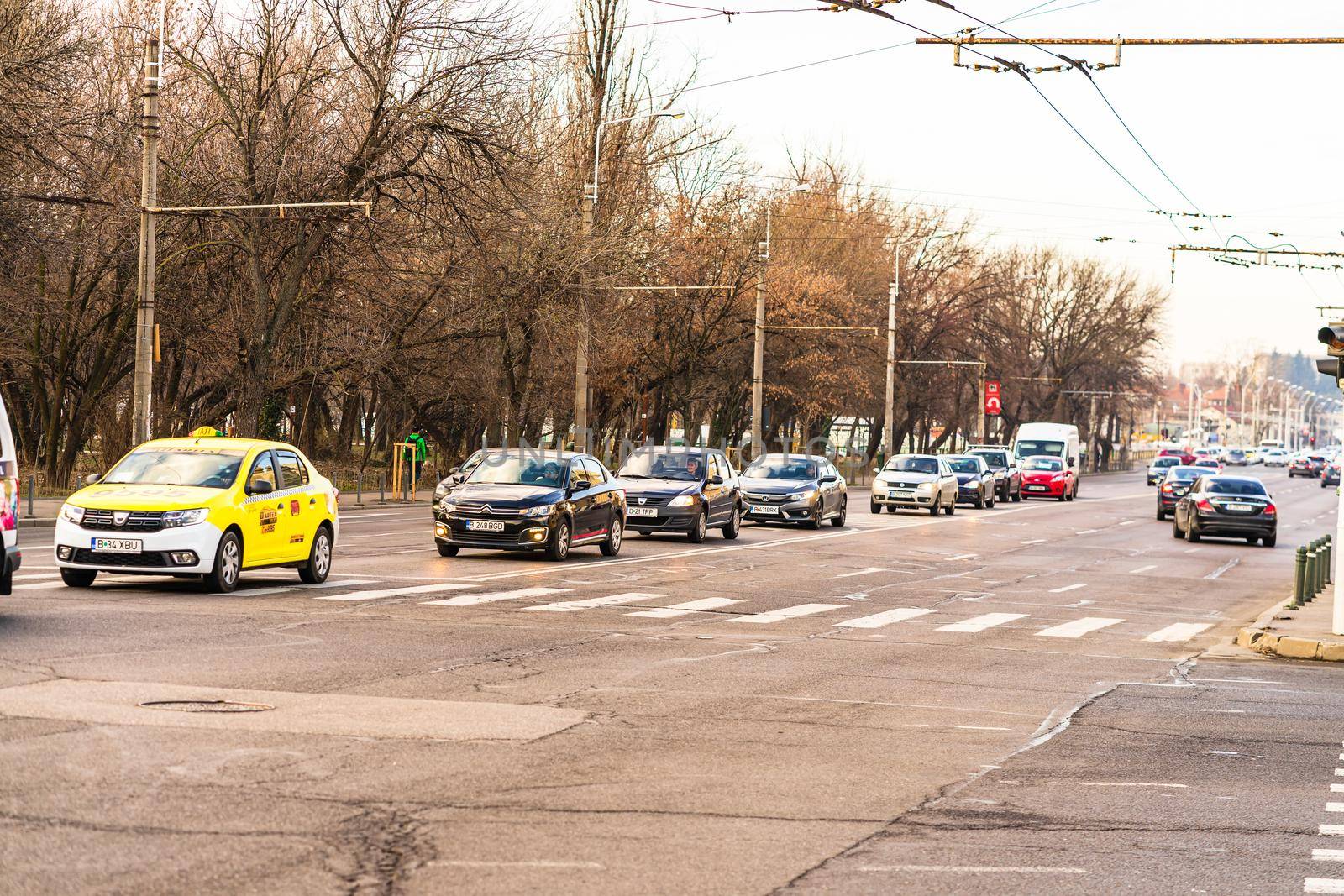 Car traffic at rush hour in downtown area of the city. Car pollution, traffic jam in the morning and evening in the capital city of Bucharest, Romania, 2020 by vladispas