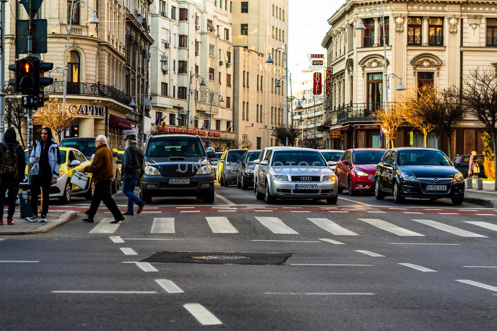 Car traffic at rush hour in downtown area of the city. Car pollution, traffic jam in the morning and evening in the capital city of Bucharest, Romania, 2021 by vladispas