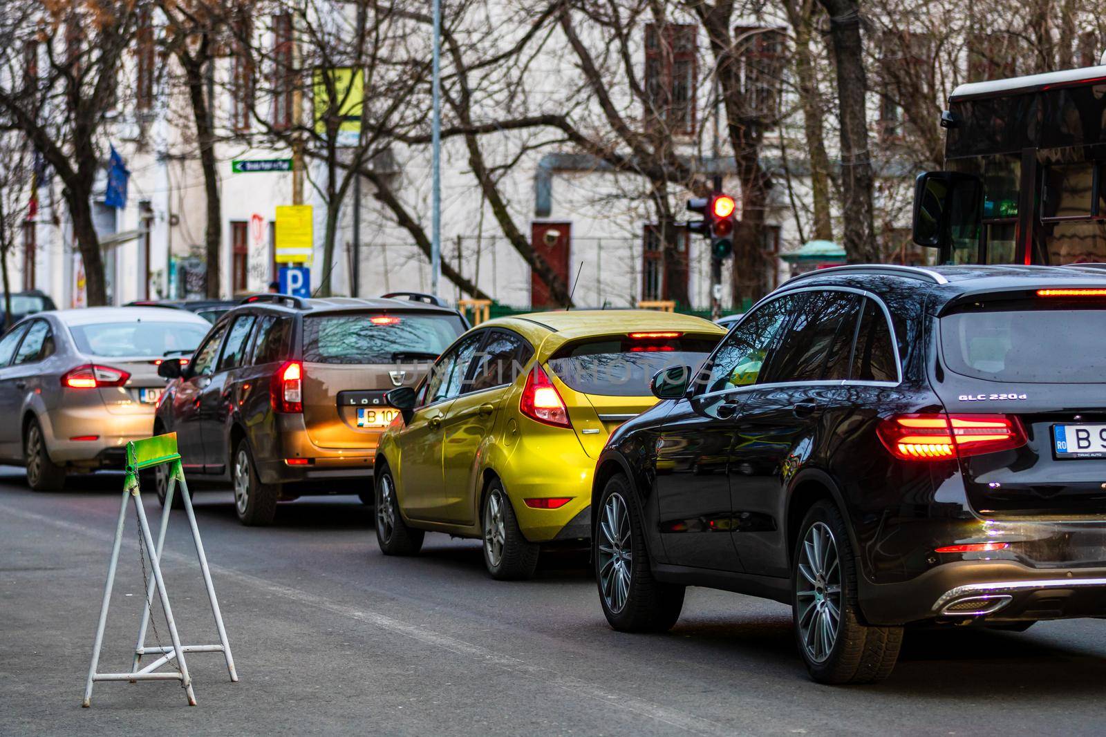 Car traffic at rush hour in downtown area of the city. Car pollution, traffic jam in the morning and evening in the capital city of Bucharest, Romania, 2021