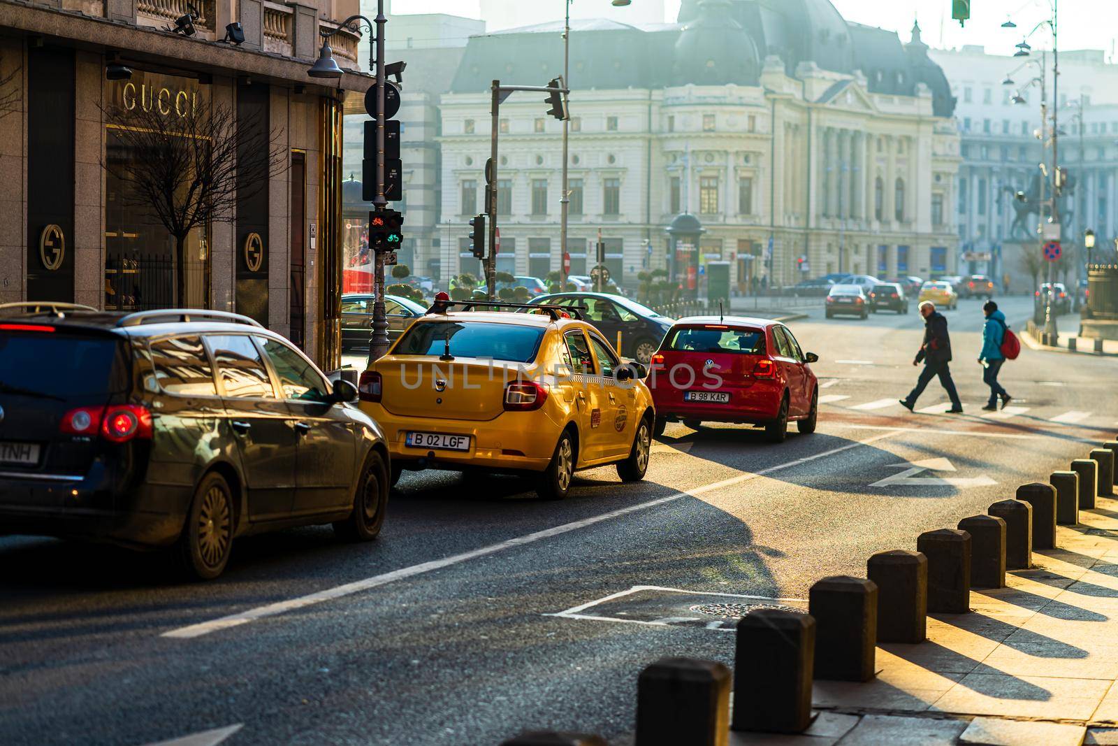 Car traffic at rush hour in downtown area of the city. Car pollution, traffic jam in the morning and evening in the capital city of Bucharest, Romania, 2021 by vladispas