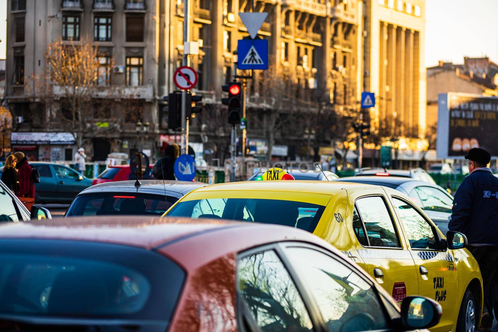 Car traffic at rush hour in downtown area of the city. Car pollution, traffic jam in the morning and evening in the capital city of Bucharest, Romania, 2021 by vladispas