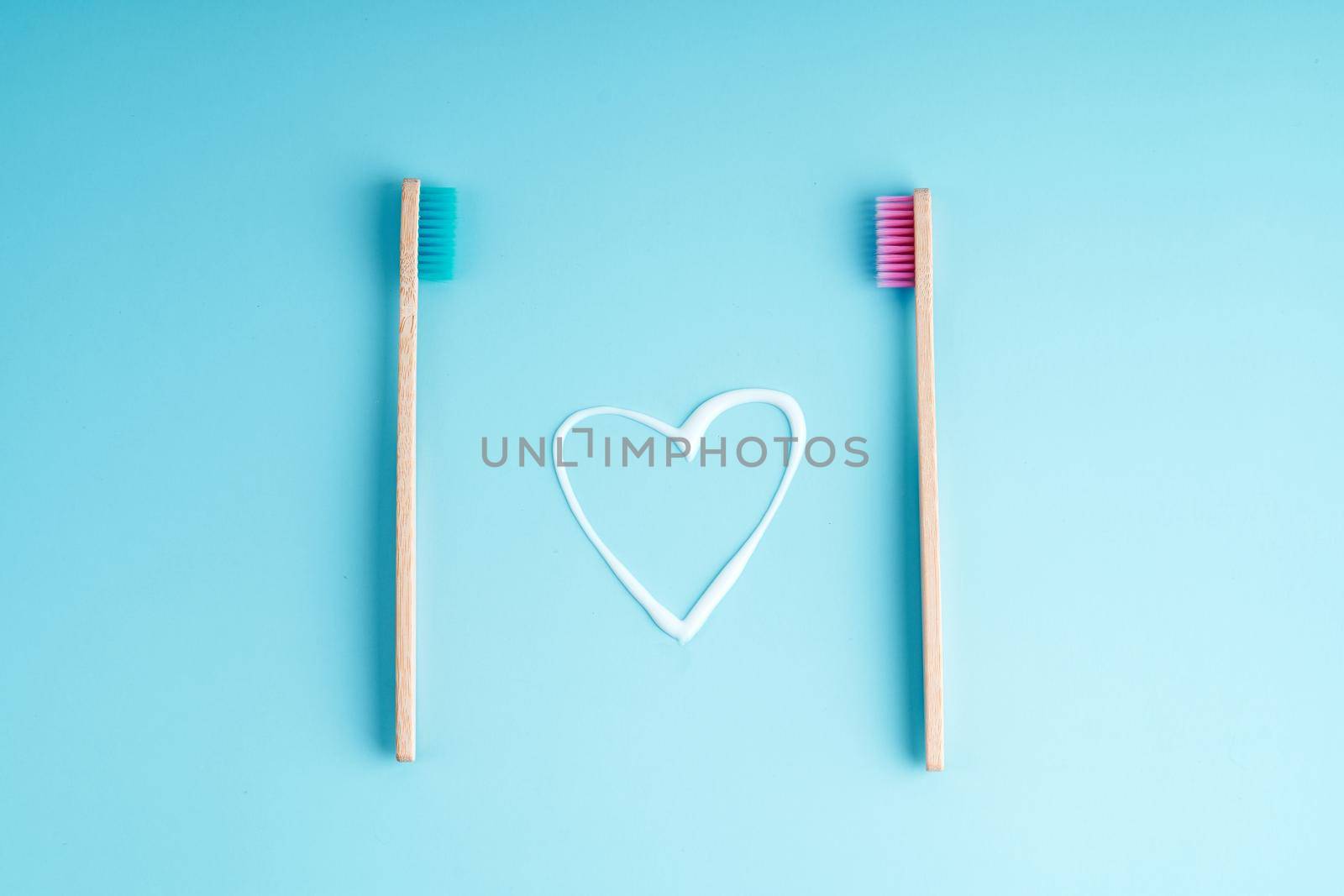 A pair of eco-friendly bamboo toothbrushes. Global environmental trends. Toothbrushes of different genders.