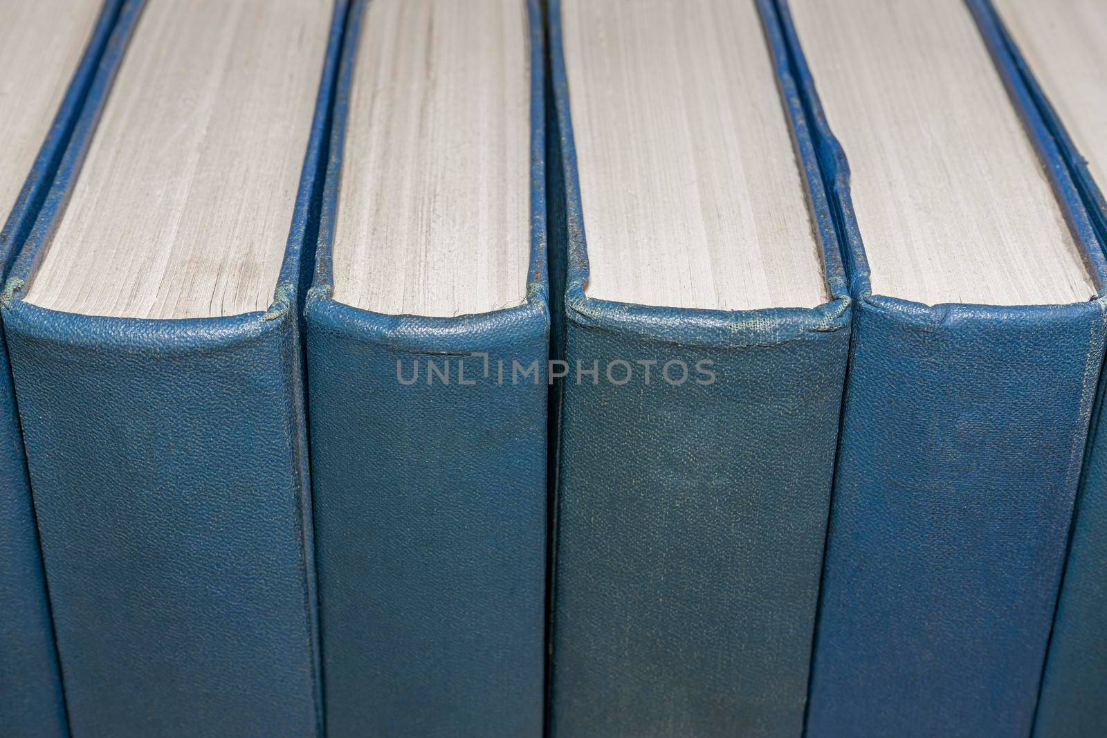 old large closed books in a row close up. High quality photo