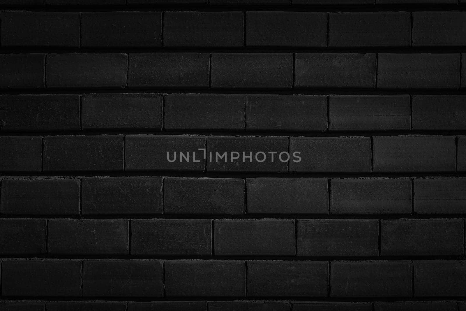 Masonry brick wall black color close-up.Texture or background