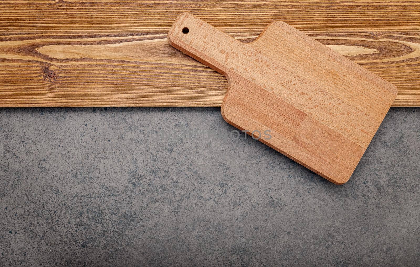 The Cutting board on shabby wooden background with copy space .