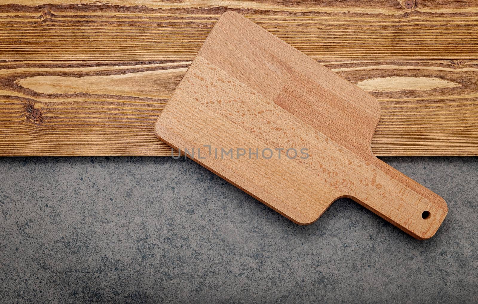 The Cutting board on shabby wooden background with copy space .