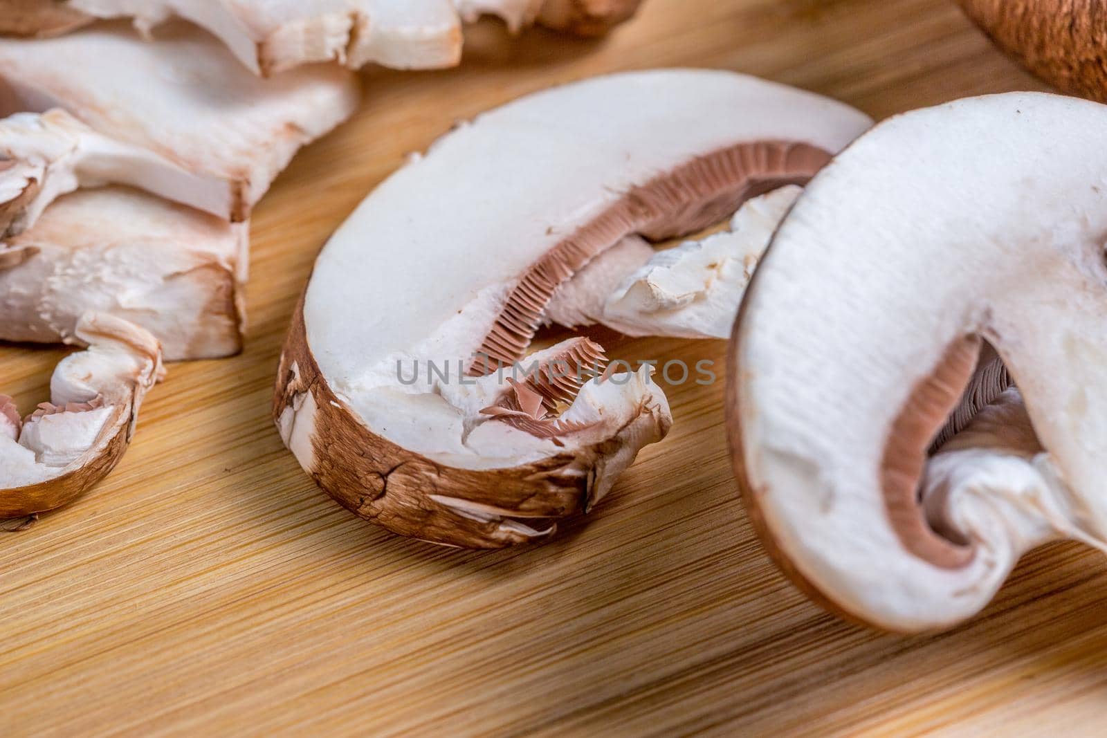 Close-up of edible mushroom Royal champignons, on a cutting board. by galinasharapova