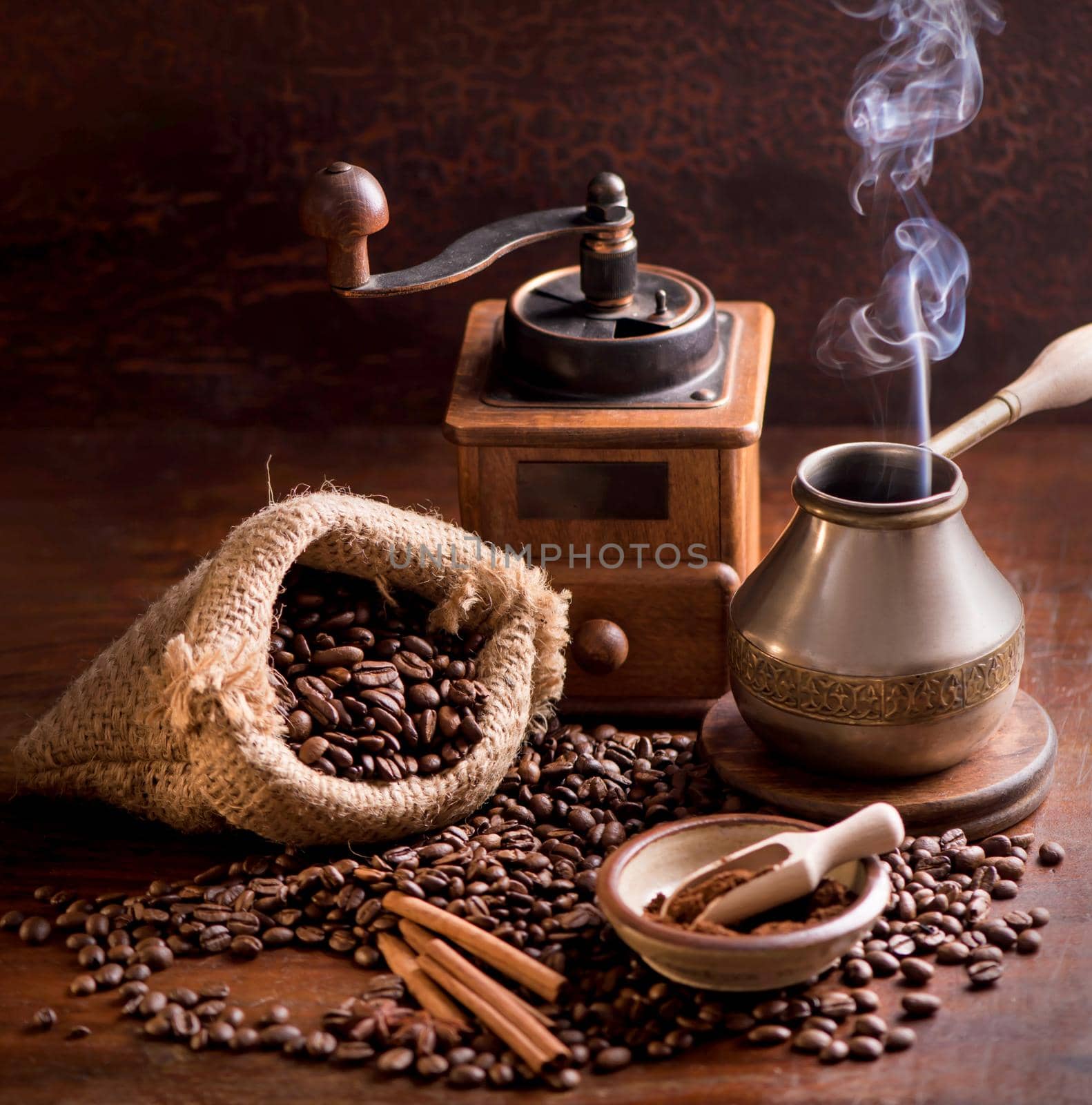 coffee beans in a sack on dark background, top view by aprilphoto