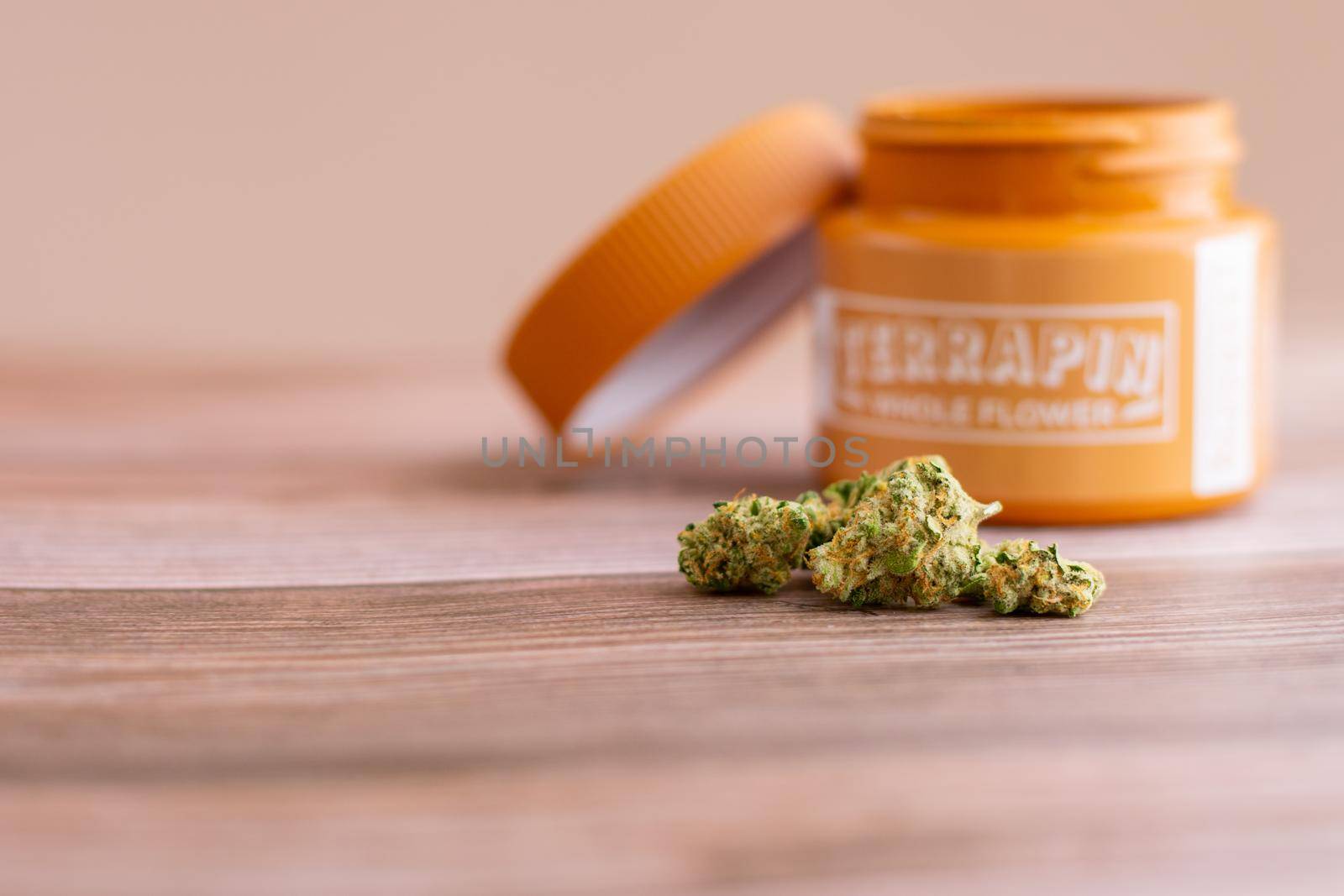 PHILADELPHIA, PA - FEBRUARY 23 2021: Devil's Lemons Medicinal Cannabis With a Terrapin Whole Flower Jar Behind It by bju12290