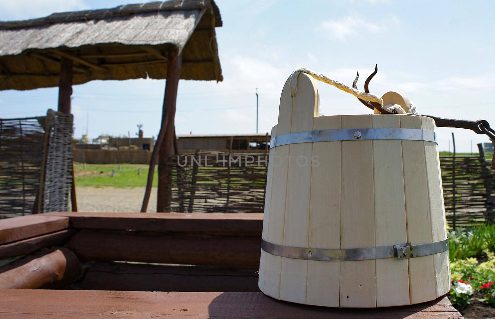 Rural landscape. Wooden bucket on the well. Krasnodar territory, Russia