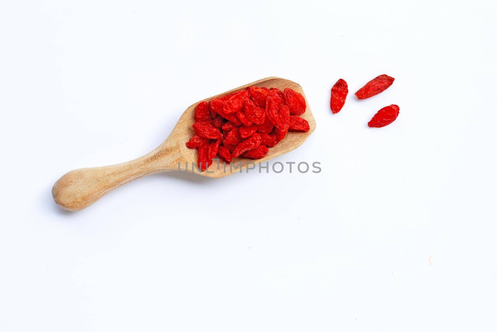 Dried goji berries on white background. Top view