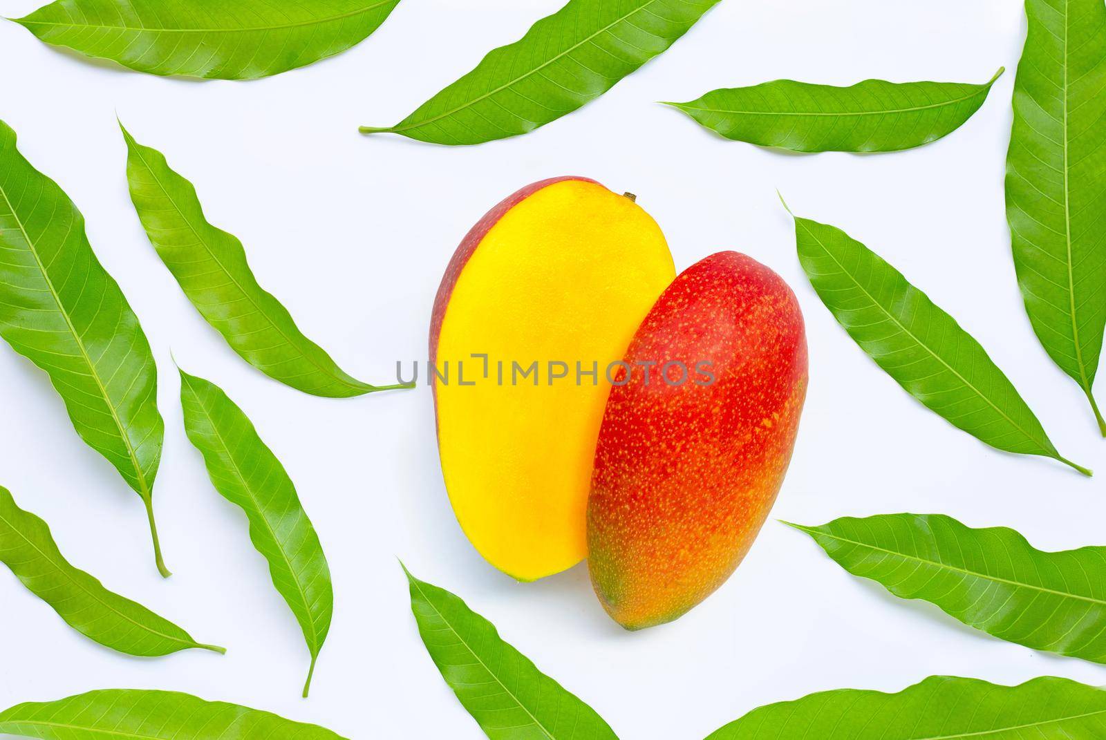 Tropical fruit, Mango with leaves on white background. Top view