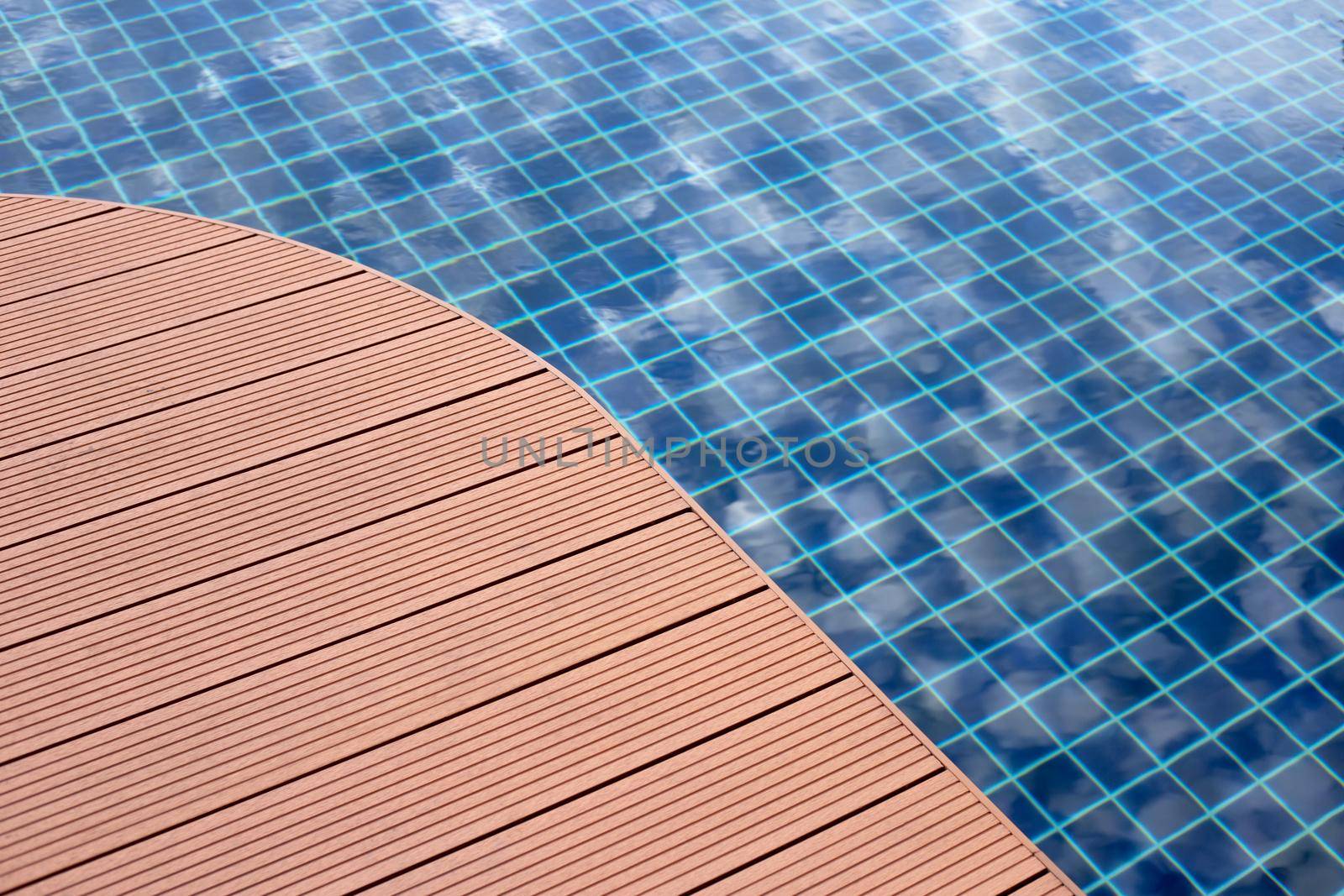 Swimming pool with wooden deck floor