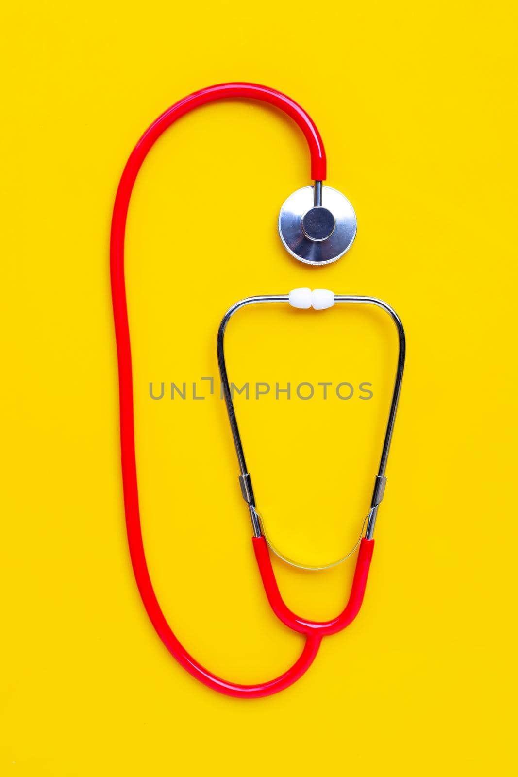 Stethoscope on yellow background. copy space by Bowonpat