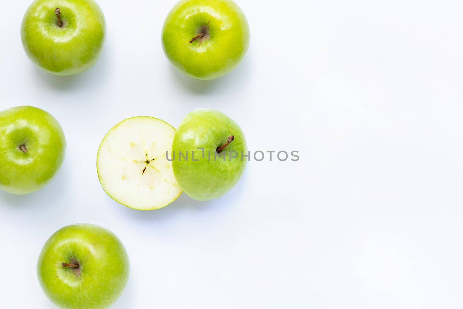 Green apples on white background. Copy space