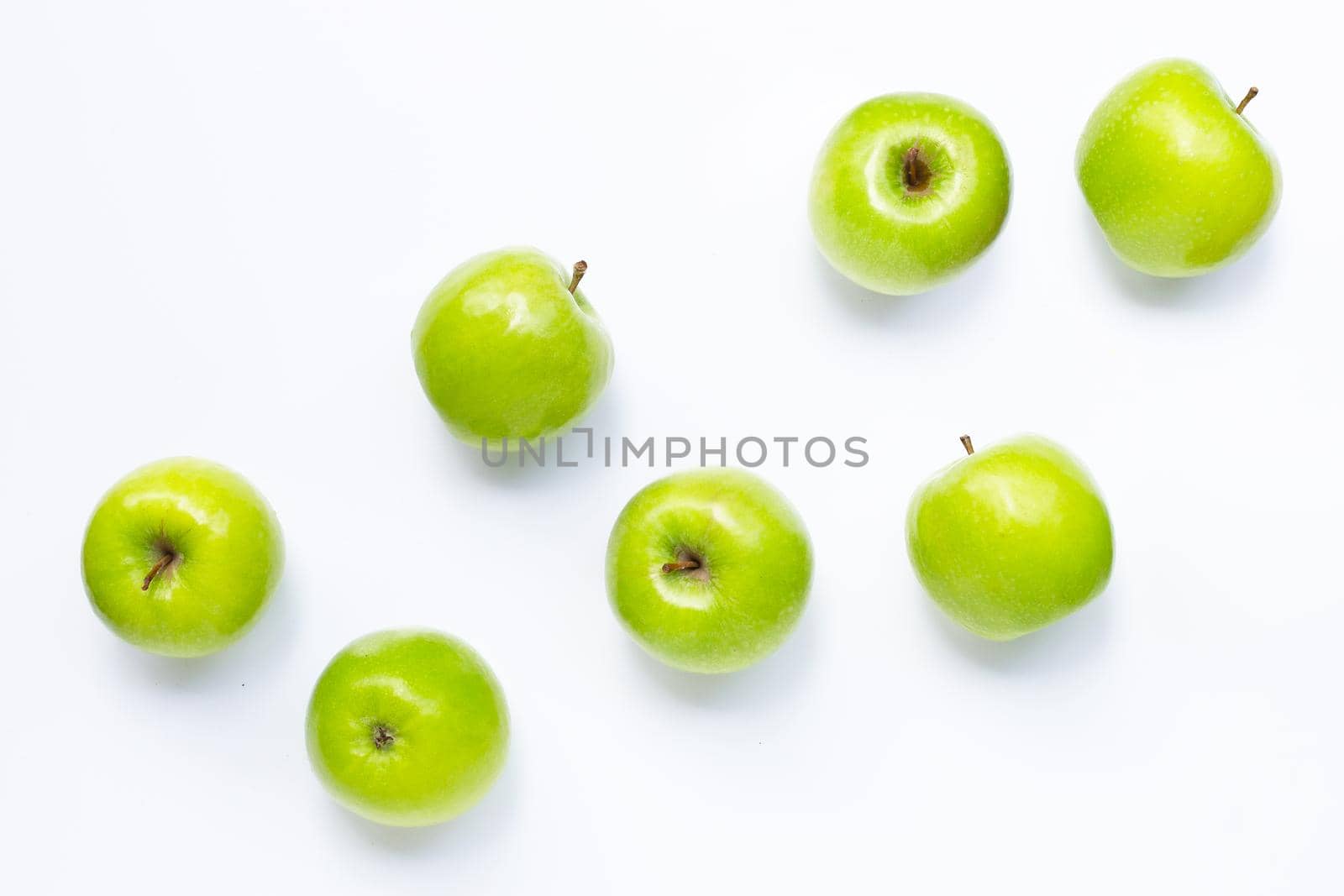 Green apples on white background. Copy space