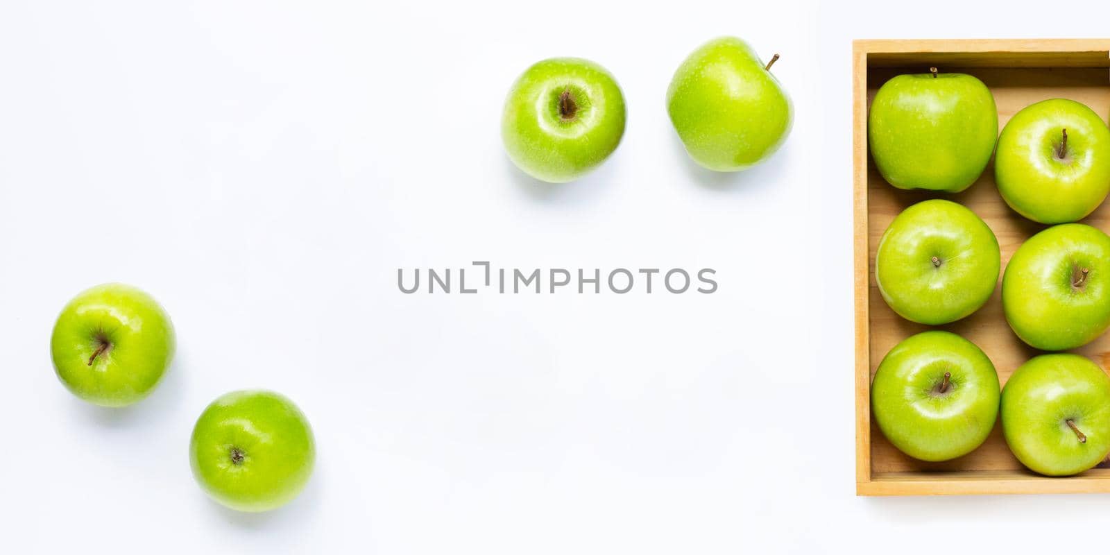 Green apples on white background. Copy space