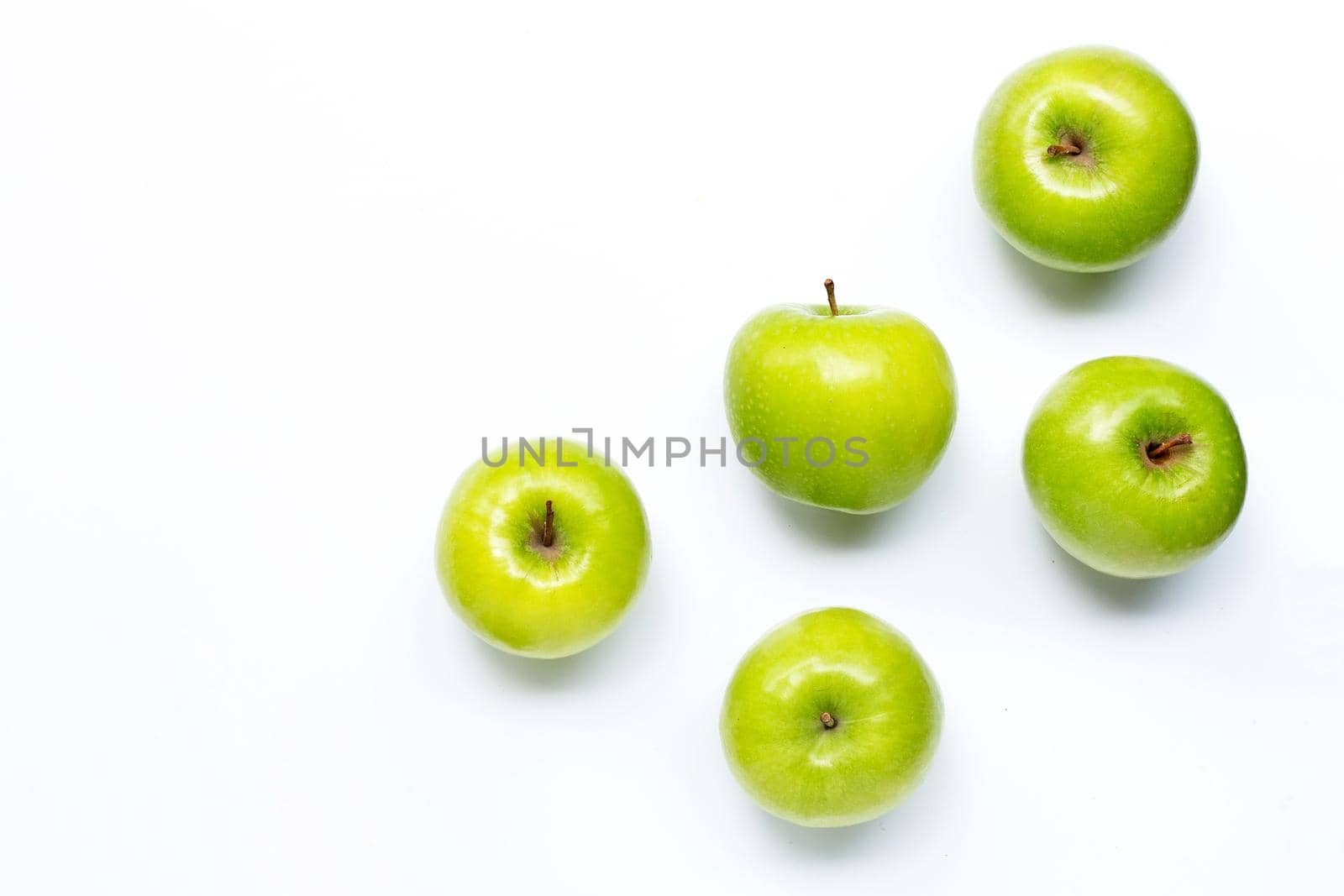 Green apples on white background. Copy space