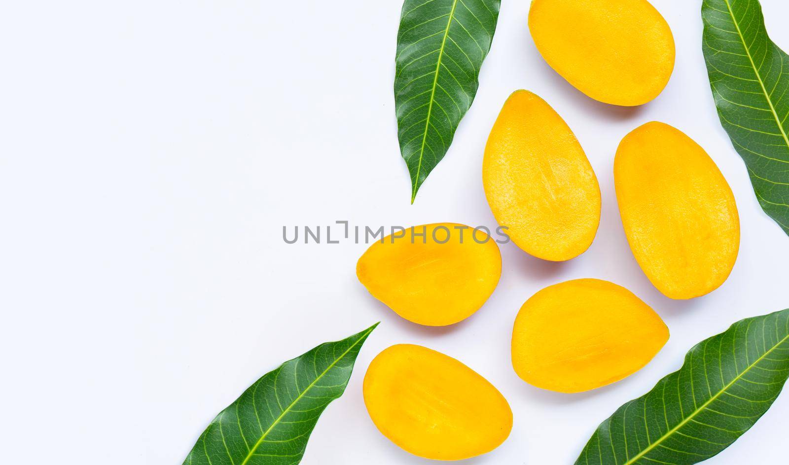Tropical fruit, Mango with leaves on white background. Top view