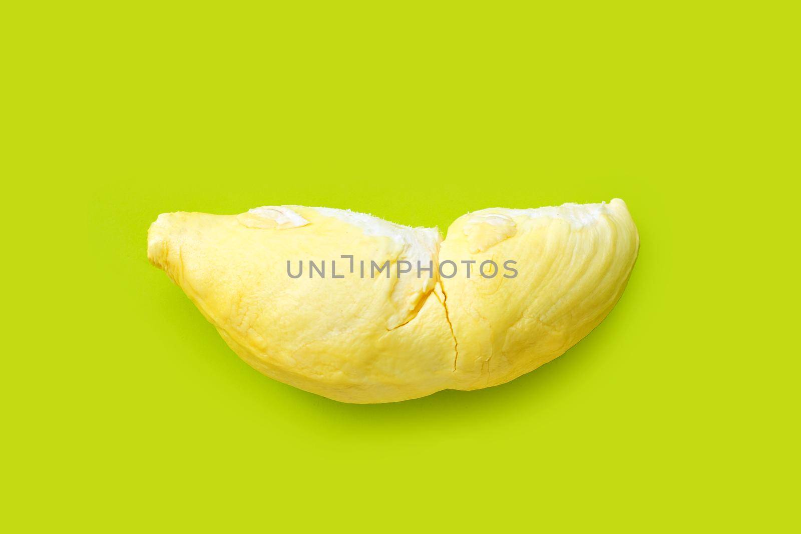 Fresh cut durian on green background. Top view