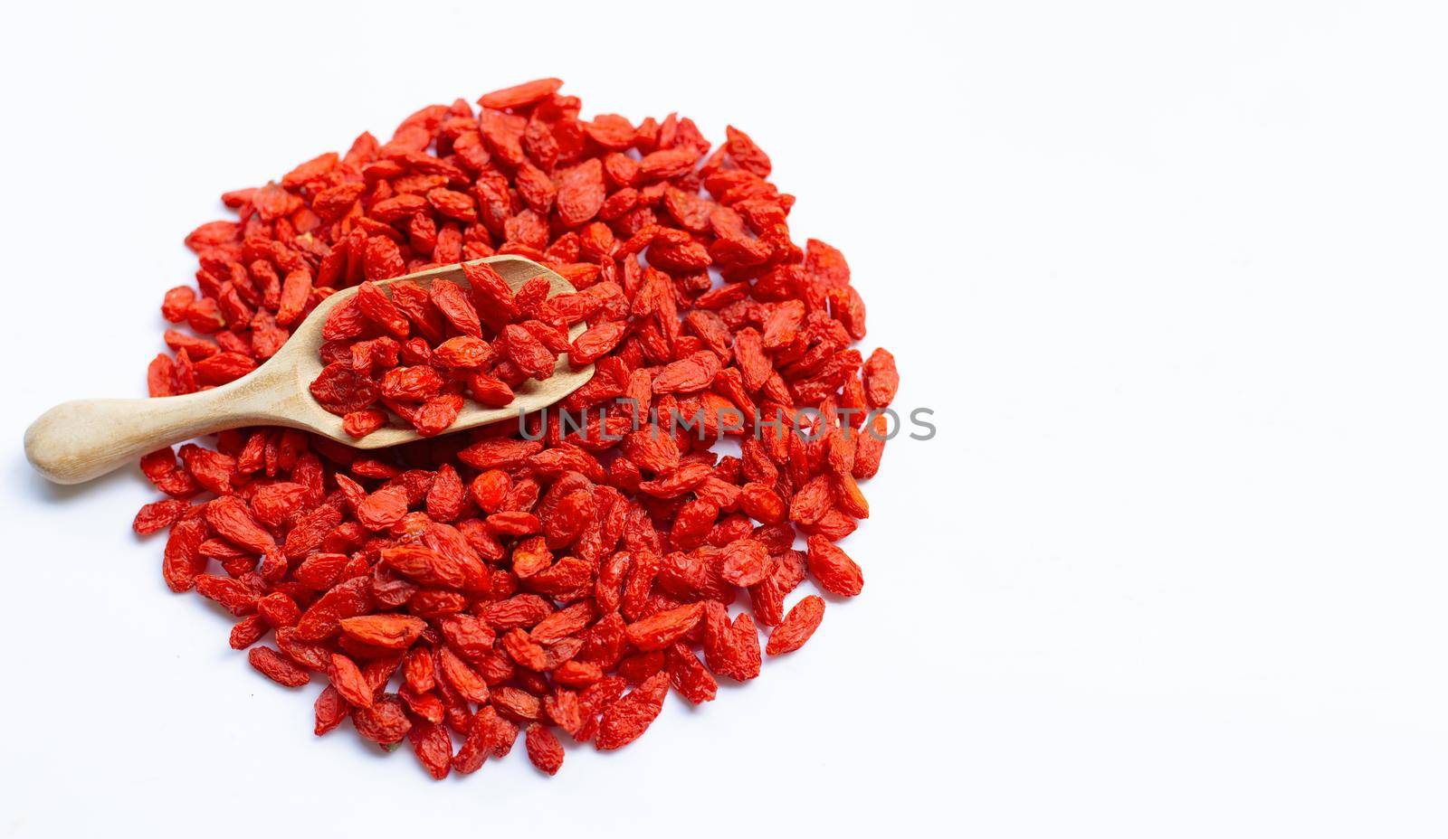 Dried goji berries on white background. Copy space