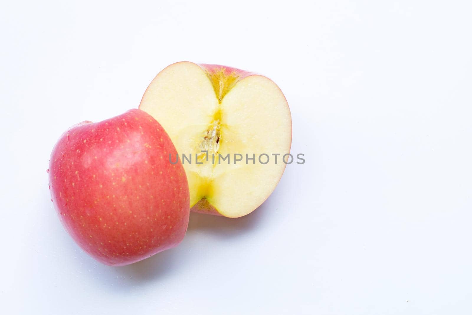 Fresh and juicy pink apple on white background.
