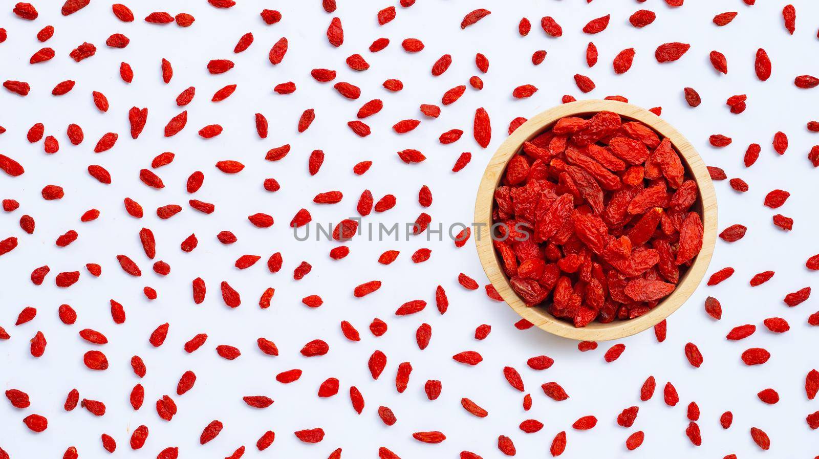 Dried goji berries on white background.