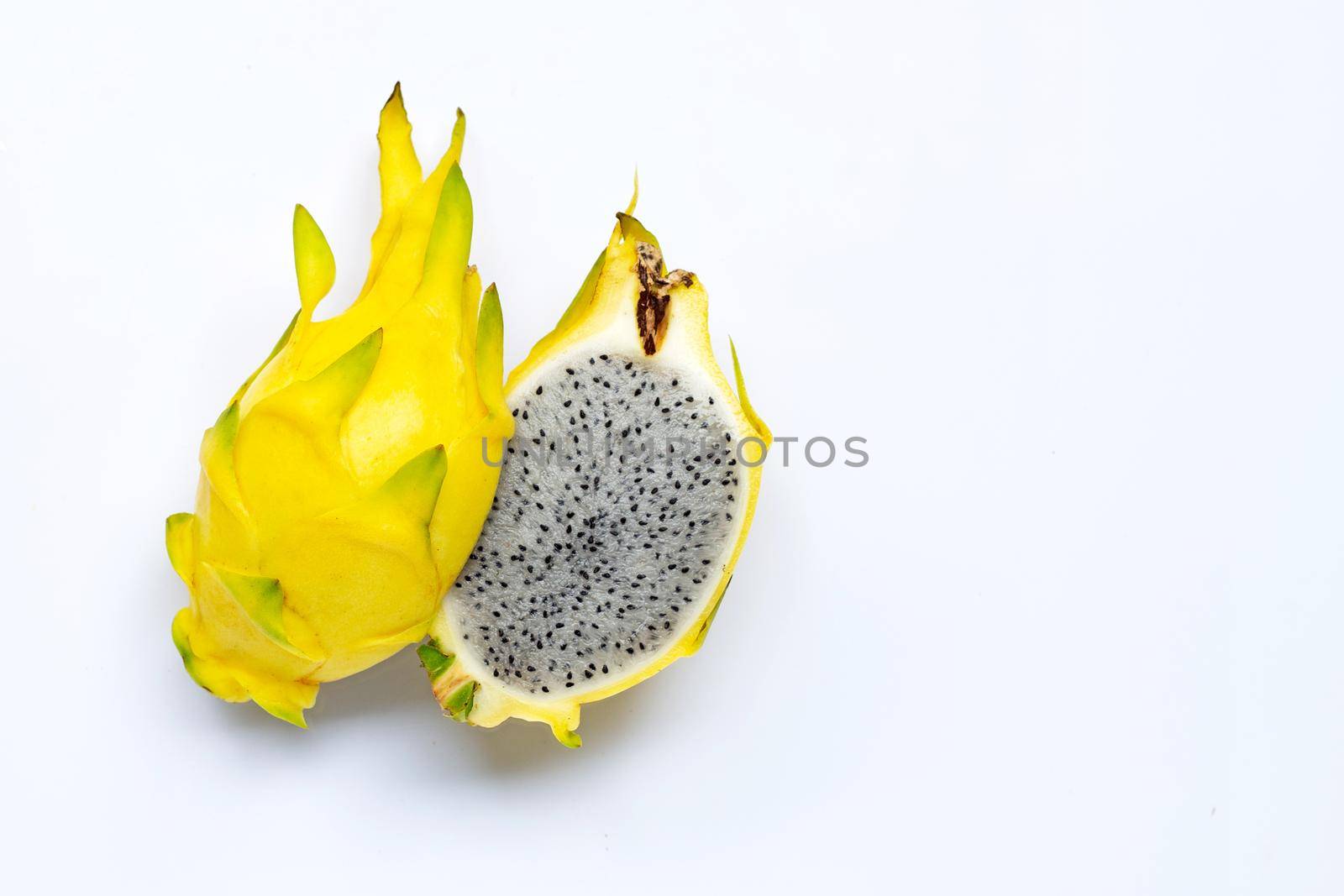 Yellow pitahaya or dragon fruit on white background. Copy space
