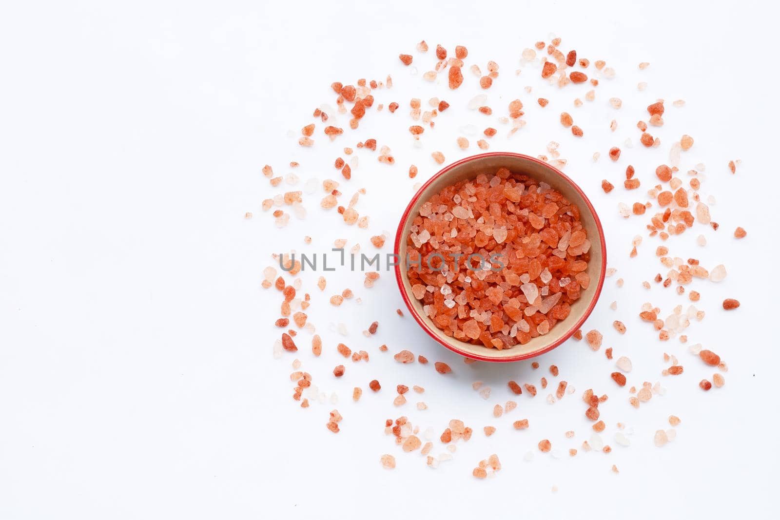 Pink himalayan salt in white background.