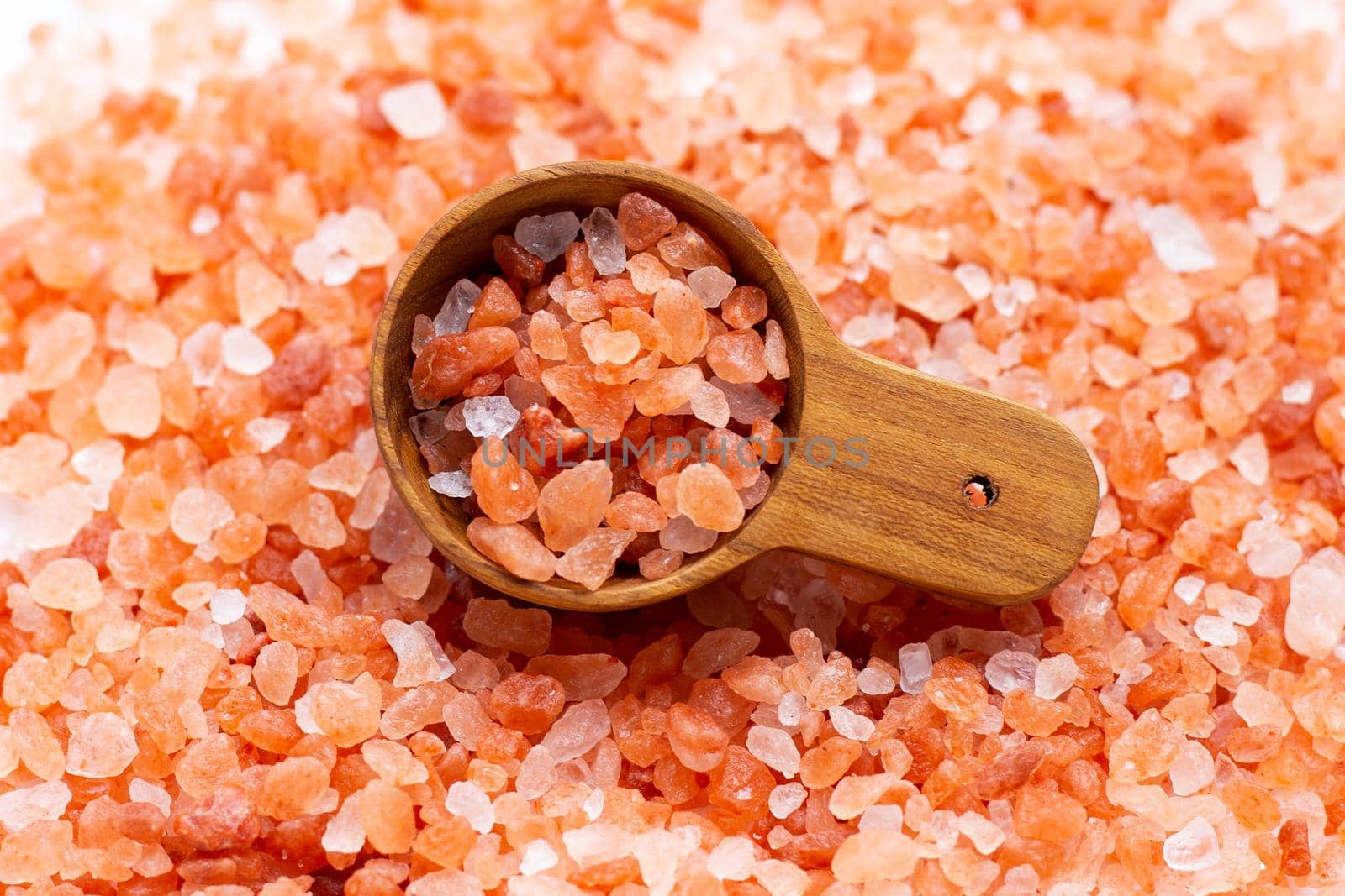 Pink himalayan salt with wooden spoon
