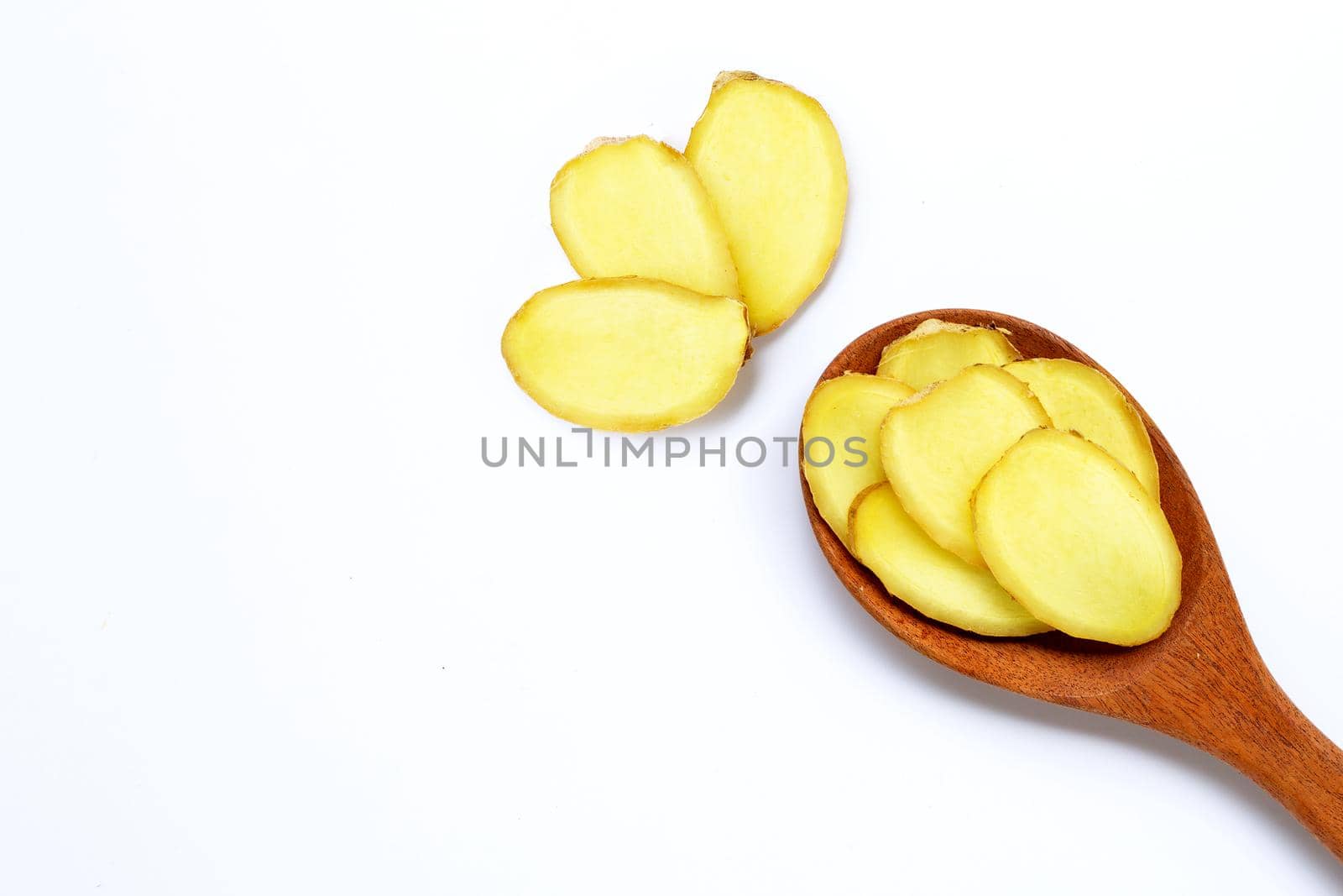 Ginger slices on white background. Copy space