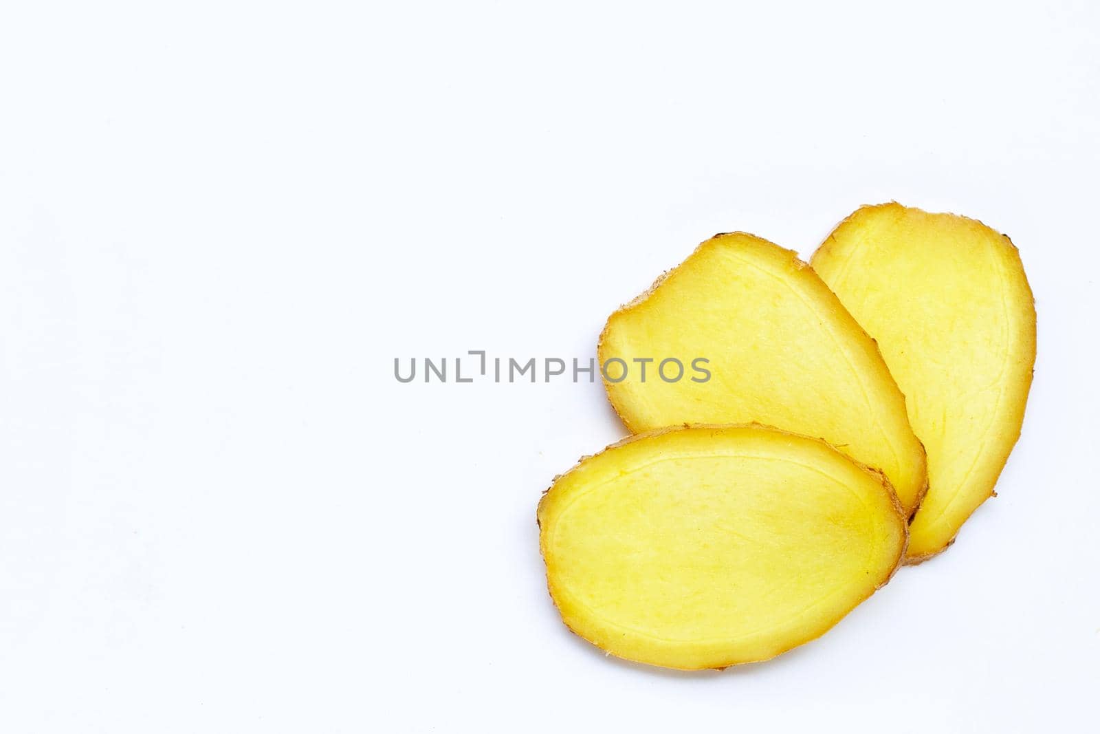 Ginger slices on white background. Copy space