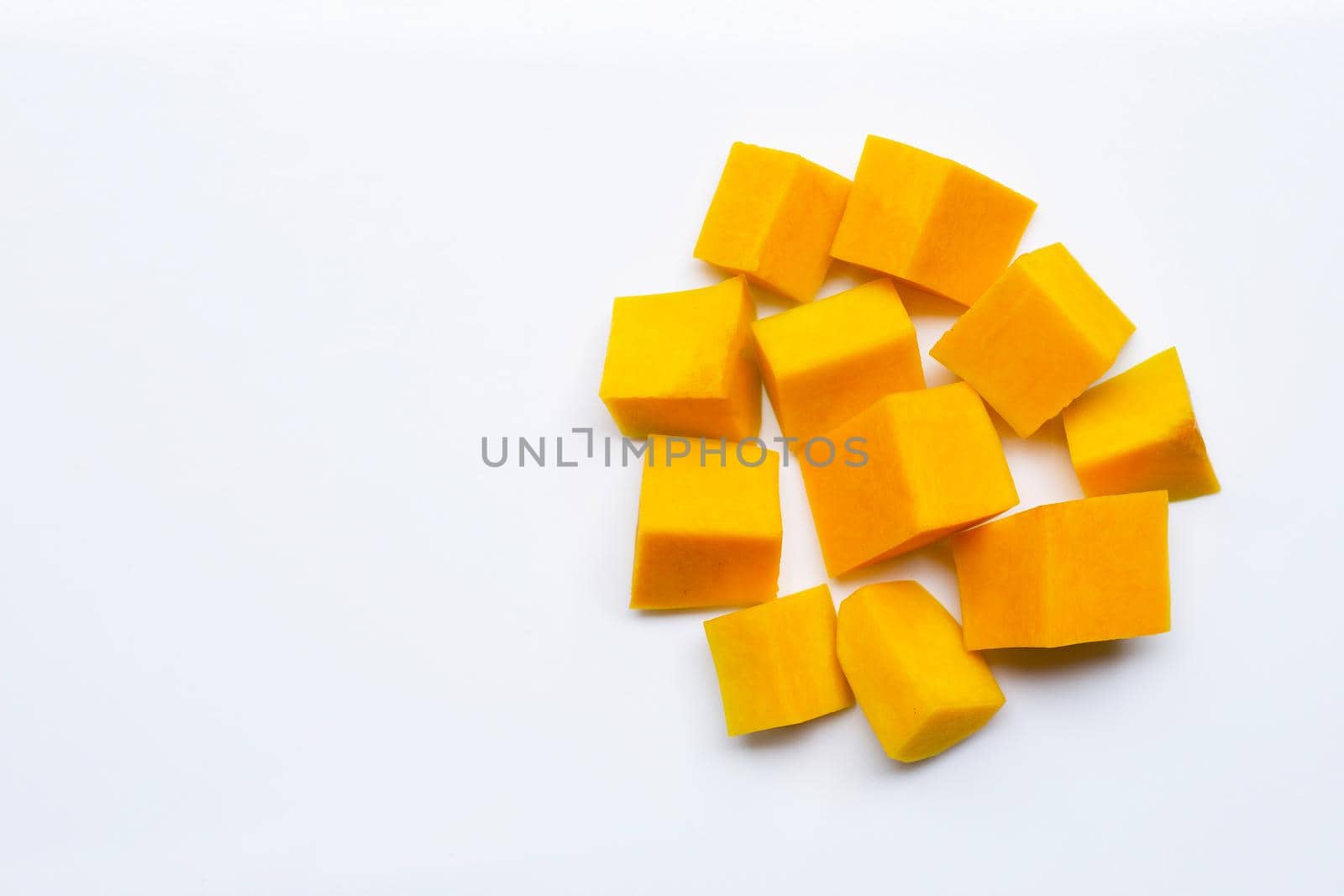 Cut and slices butternut squash on white background.