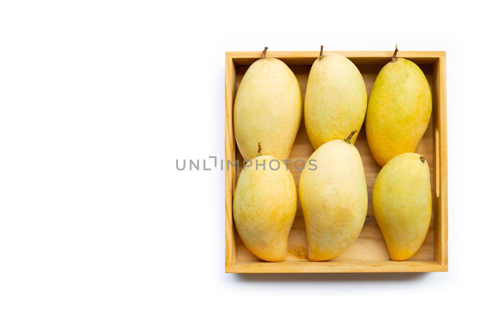 Tropical fruit, Mango  in wooen box on white background. Top view